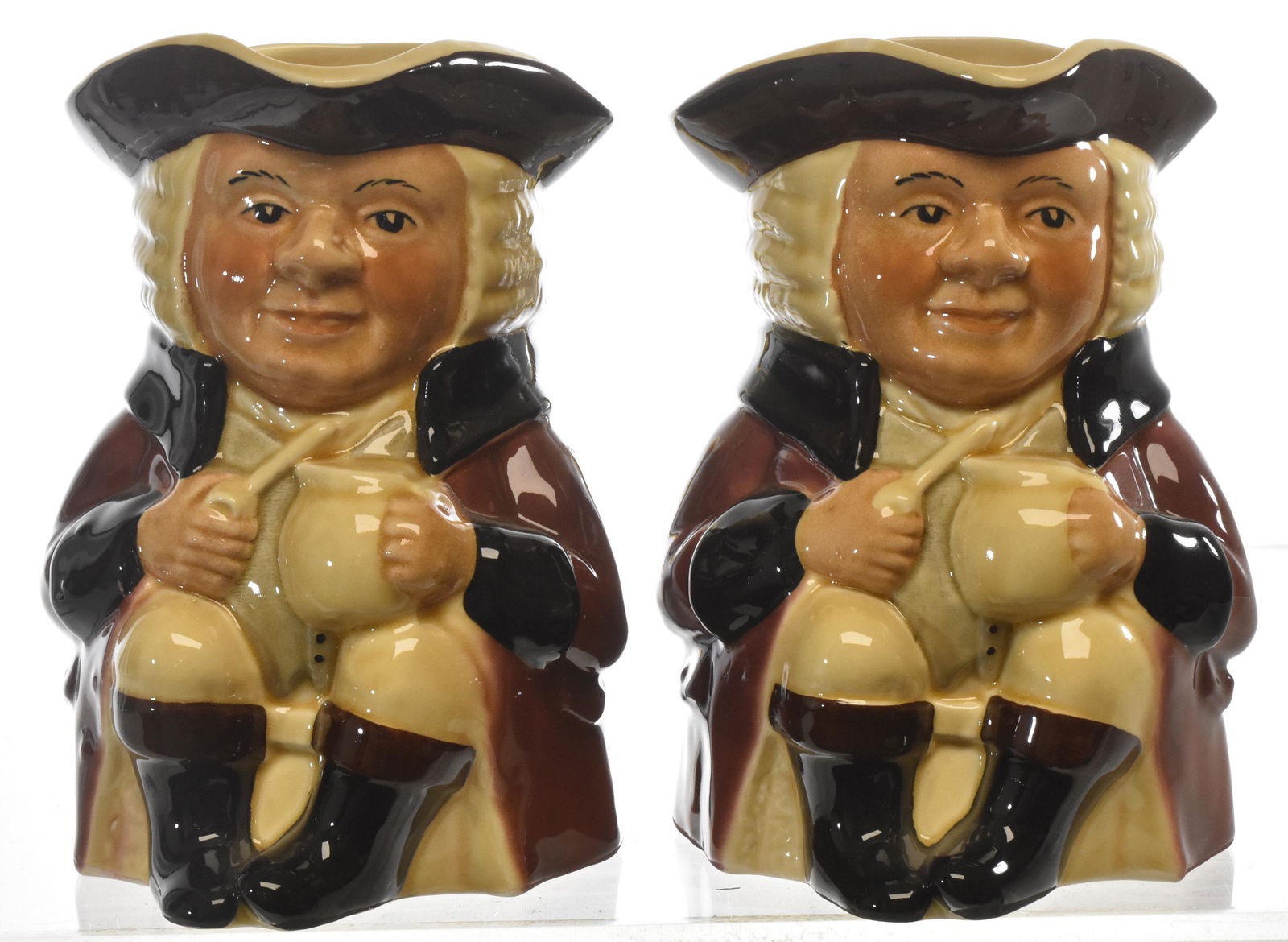 Pair of "Tony Wood" Staffordshire Toby Mugs: Each measures approx. 7"h. Both are marked "Tony Wood Staffordshire, England" and stamped "Aaron".