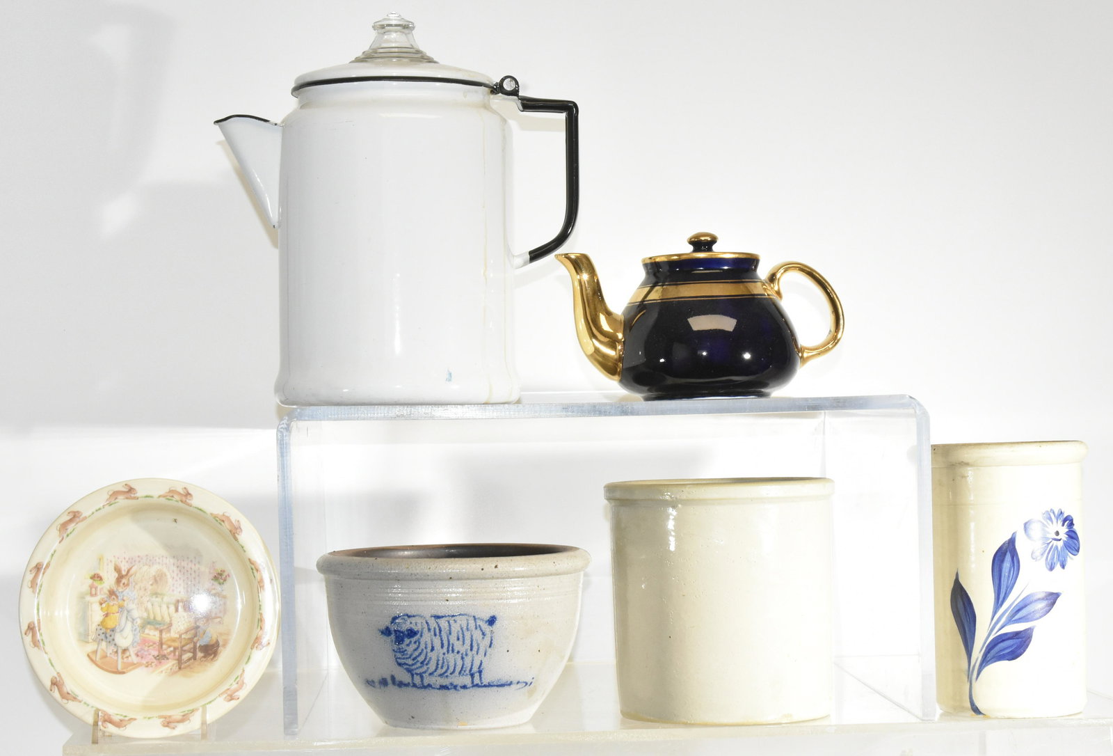 Country Kitchen Ware Grouping: An enameled coffee pot measuring approx. 10"h, two contemporary decorated crocks, a royal Doulton Bunnykins baby plate, a straight crock and a small Hall teapot.