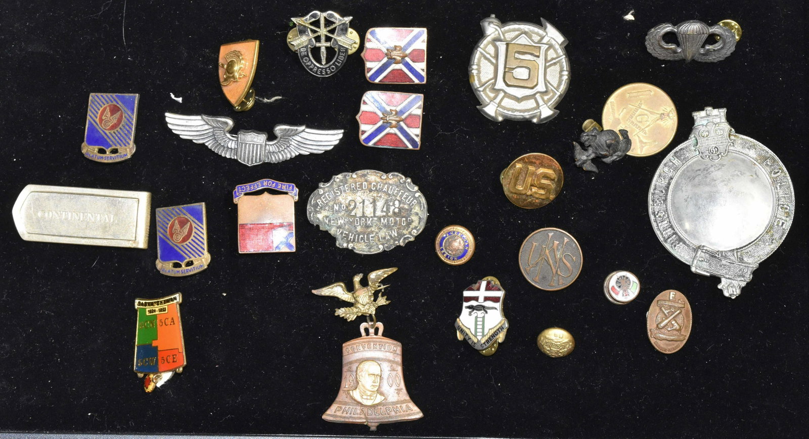 Military and other Medals: Paratrooper and Marine lapel pins, a 1900 Philadelphia convention pin, a vintage Pittsburg police badge, a chauffeur license and enameled pins.