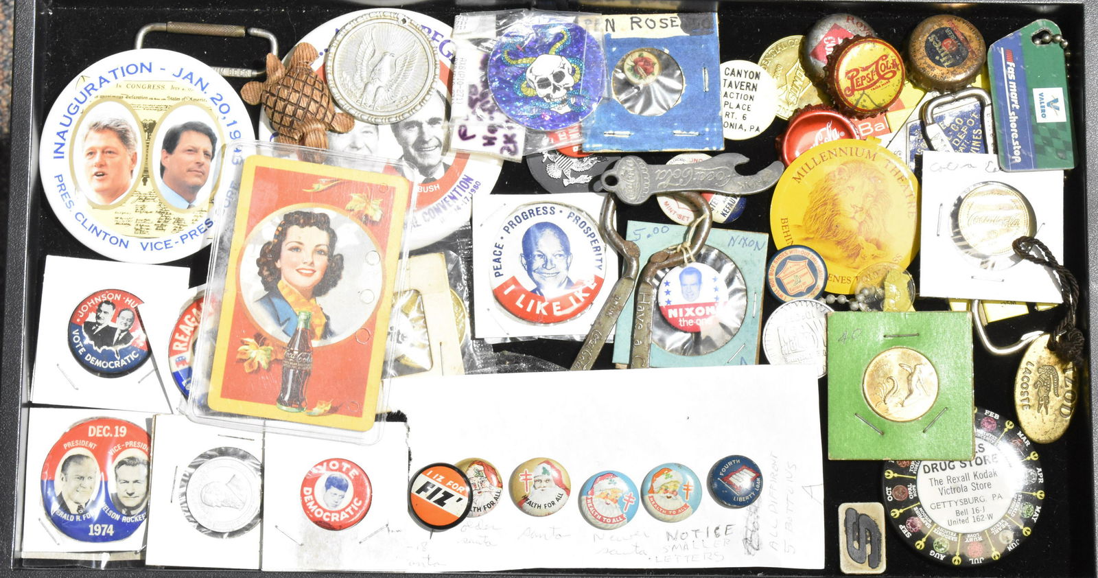 Pin Backs and Advertising: Four vintage Santa pep pins, Presidential pin backs, two Coca Cola bottle openers and other vintage advertising.