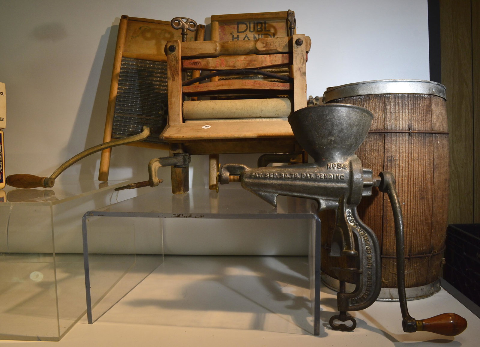 Mixed Country Grouping: A nail keg measuring approx. 12"h, two wash boards, a wringer and a large "Enterprise" meat grinder.