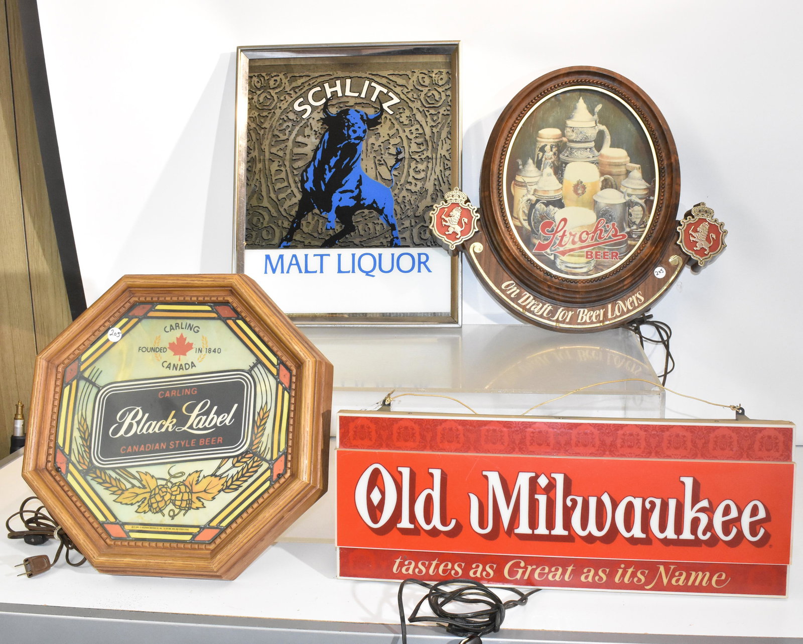 Beer Lights and Advertising: Including Black Label, Stroh's and Old Milwaukee beer lights and a Schlitz beer mirror.