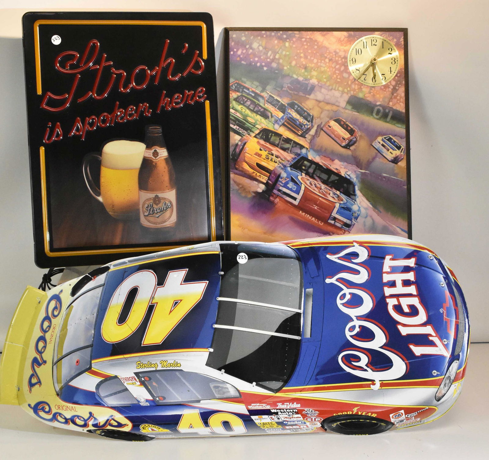 Beer and Nascar Lights and Signs: A Stroh's beer light, a 1993 Nascar clock with certificate and a Coors Light Nascar sign.