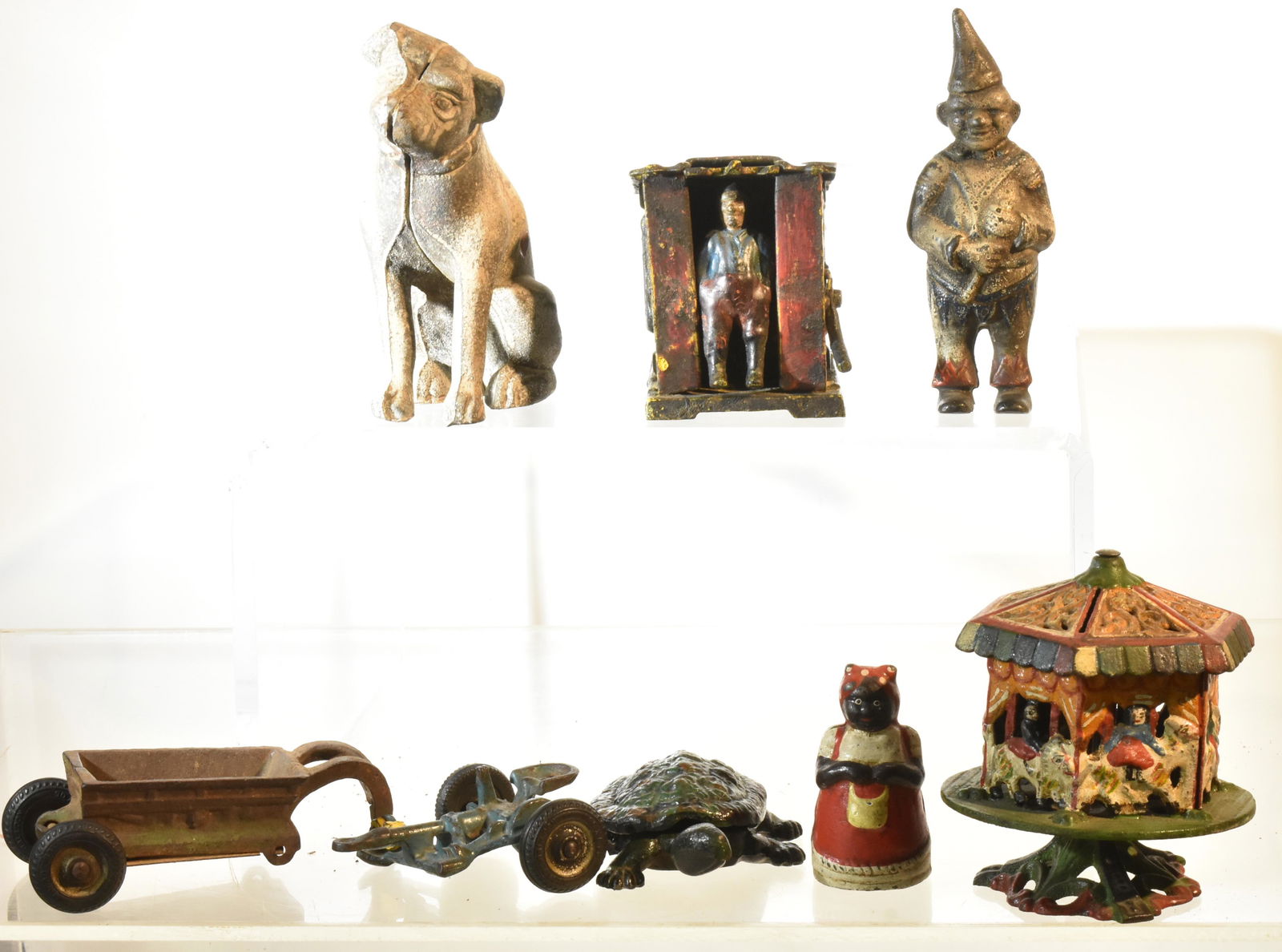 Vintage and Newer Cast Iron Toys: Vintage hinged turtle by "Notco Fory and Spec. Co." Pottstown, Pa, two vintage implement carts and a selection of cast iron toys of various age.