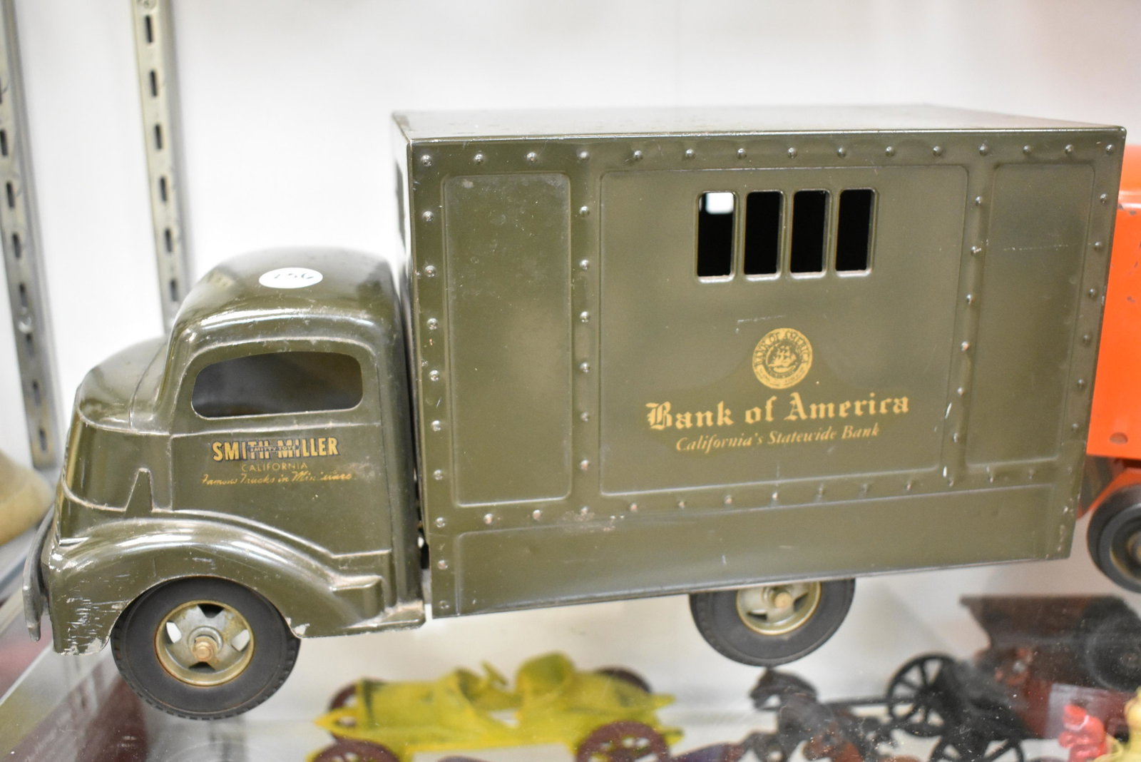 Vintage Smith Miller Armored Car: Measures approx. 14" in length. It has original paint and retains all decals. It has hard rubber wheels and original lock with three keys. Item appears to be complete.