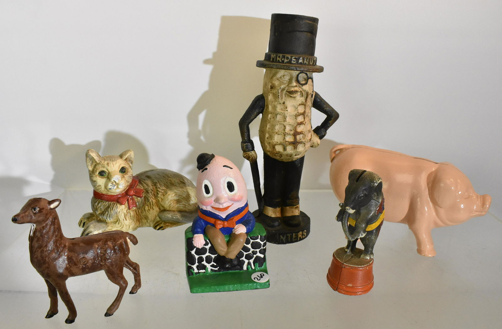 Contemporary Cast Iron Banks: Including Mr..Peanut, pig banks, a deer bank and more.