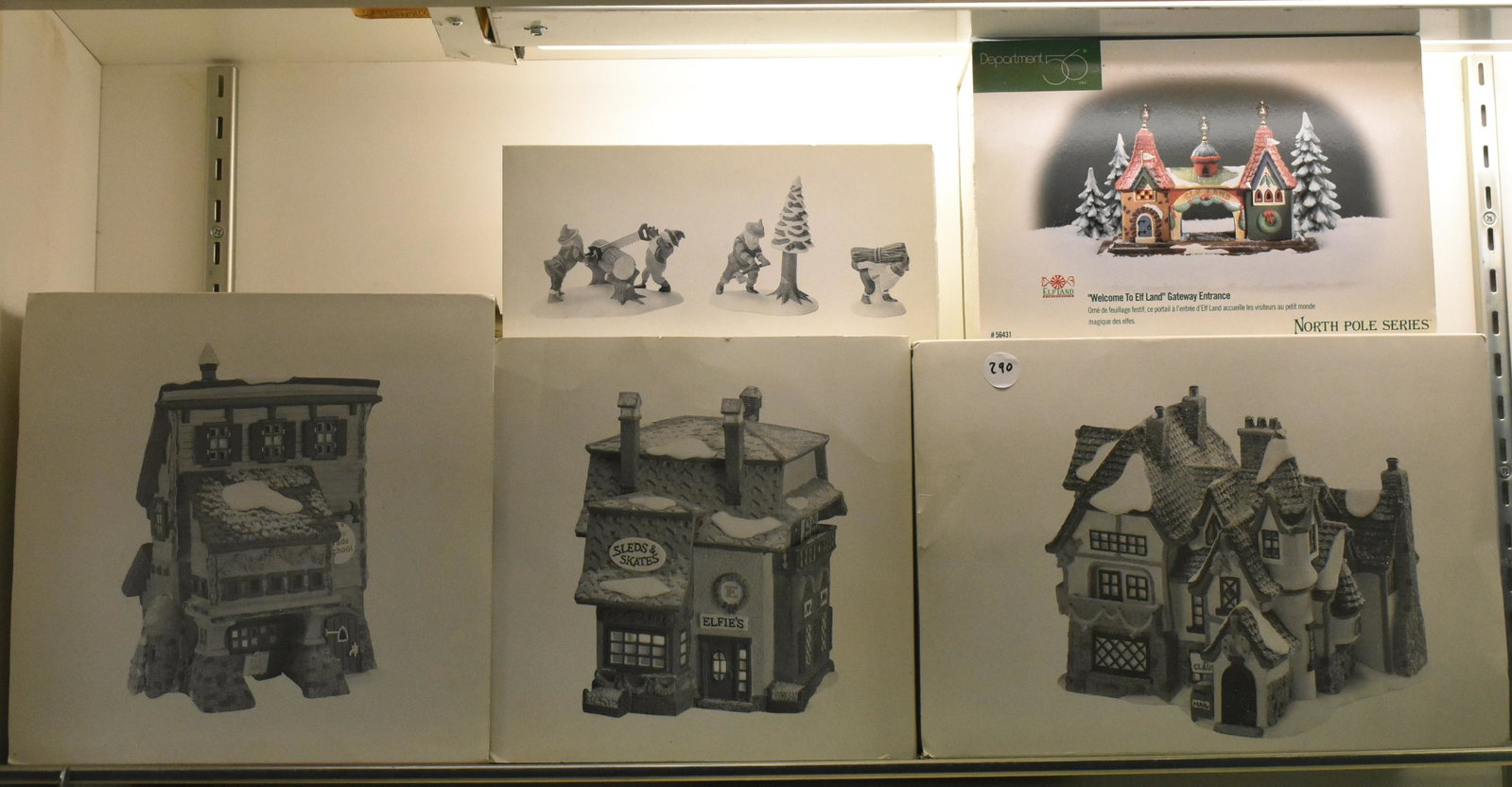 Dept 56 North Pole Series NIB: Elfin Sleds and Skates, Elves Trade School, Elf Land Gateway Entrance, Woodsman Elves and Santa's Workshop. Five total pieces.