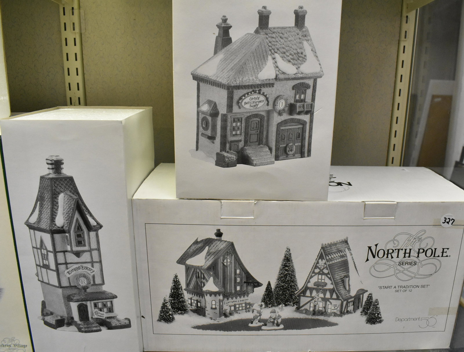 Dept 56 North Pole Series NIB: Start a Tradition 12 piece set, Rimpy's Bakery and Orly's Bell and Harness Supply.