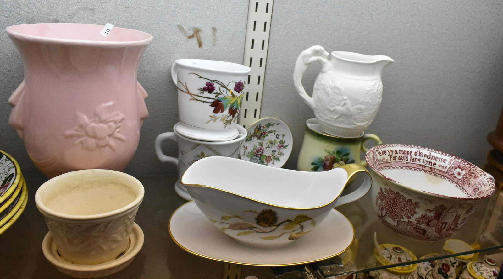 Mixed Dishware and Pottery: including 2 McCoy pots, three shaving mugs, a Wedgwood creamer, red transfer ware handled soup bowl reads Take Ye A Cuppe o'kindness for Auld langsyne inside lip, no marking on bottom, hairline on edg