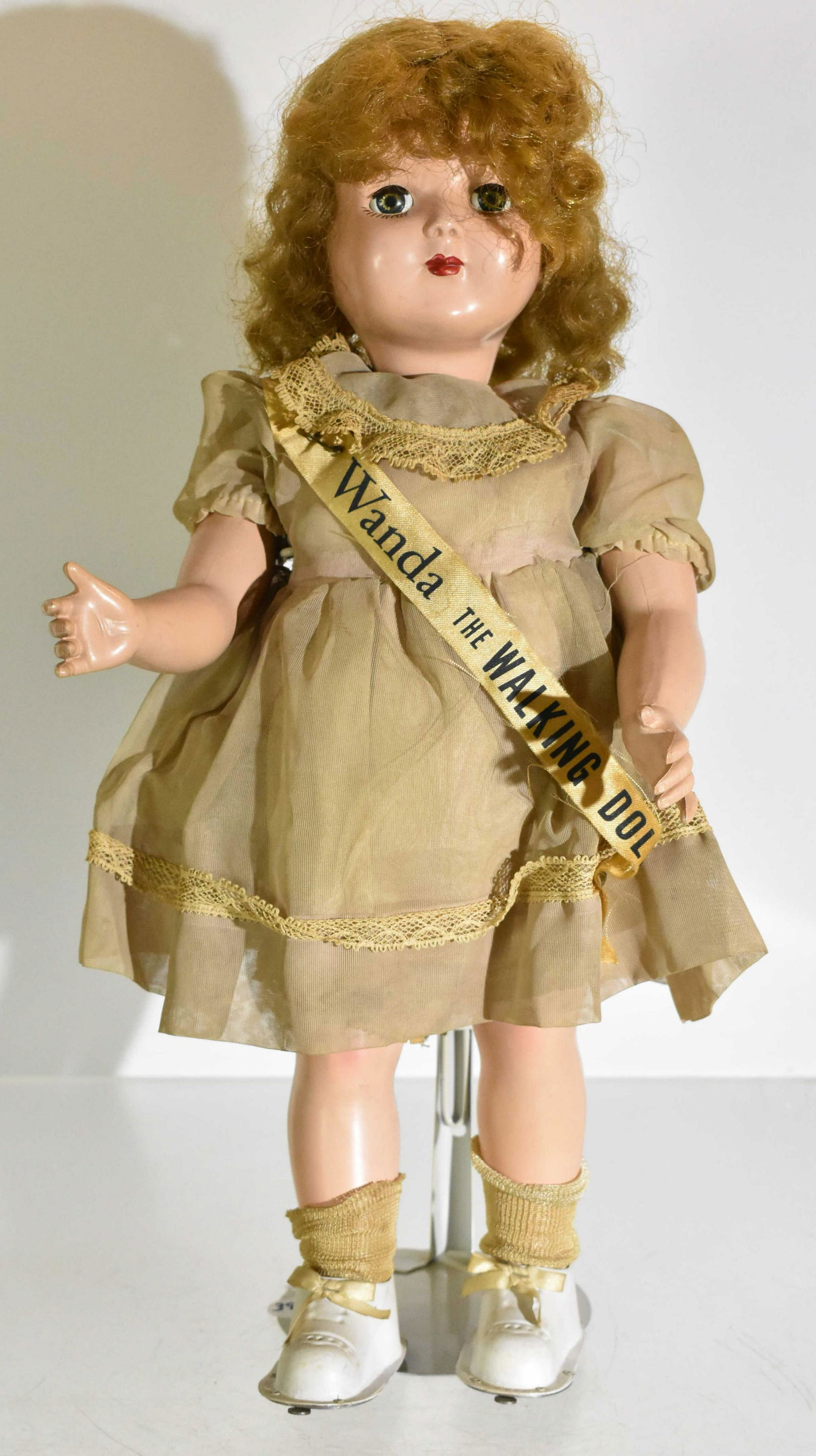Wanda the Walking Doll on Stand: Made of hard plastic material and manufactured by the Advance Doll & Toy Co. circa 1951, Wanda the Walking Doll doll measures 18" high. Eyes shut when laying down. It is in great visual shape for its