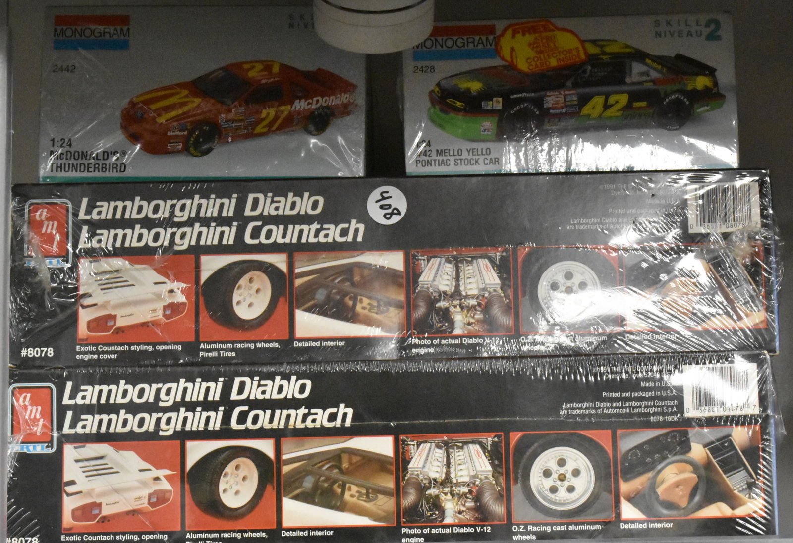 2 Lambo Diablo and Countach Model Car Kits: 2 Lamborghini Diablo and Countach Model Car Kits Model #8078 by Ertl also with 2 Monogram cars McDonald's Thunderbird and Mello Yellow Pontiac Stock Car 1:24th scale still sealed.