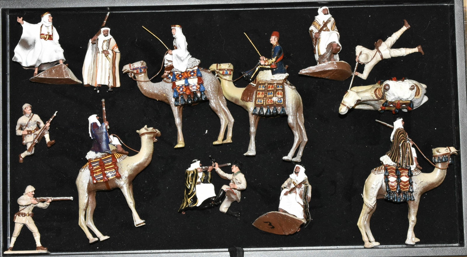 13 Cast Metal Military Toy Figures: Hand painted figures including some on camelback and others with weapons (unmarked). These look like Lawrence of Arabia models. The total weight is approx 6 pounds.