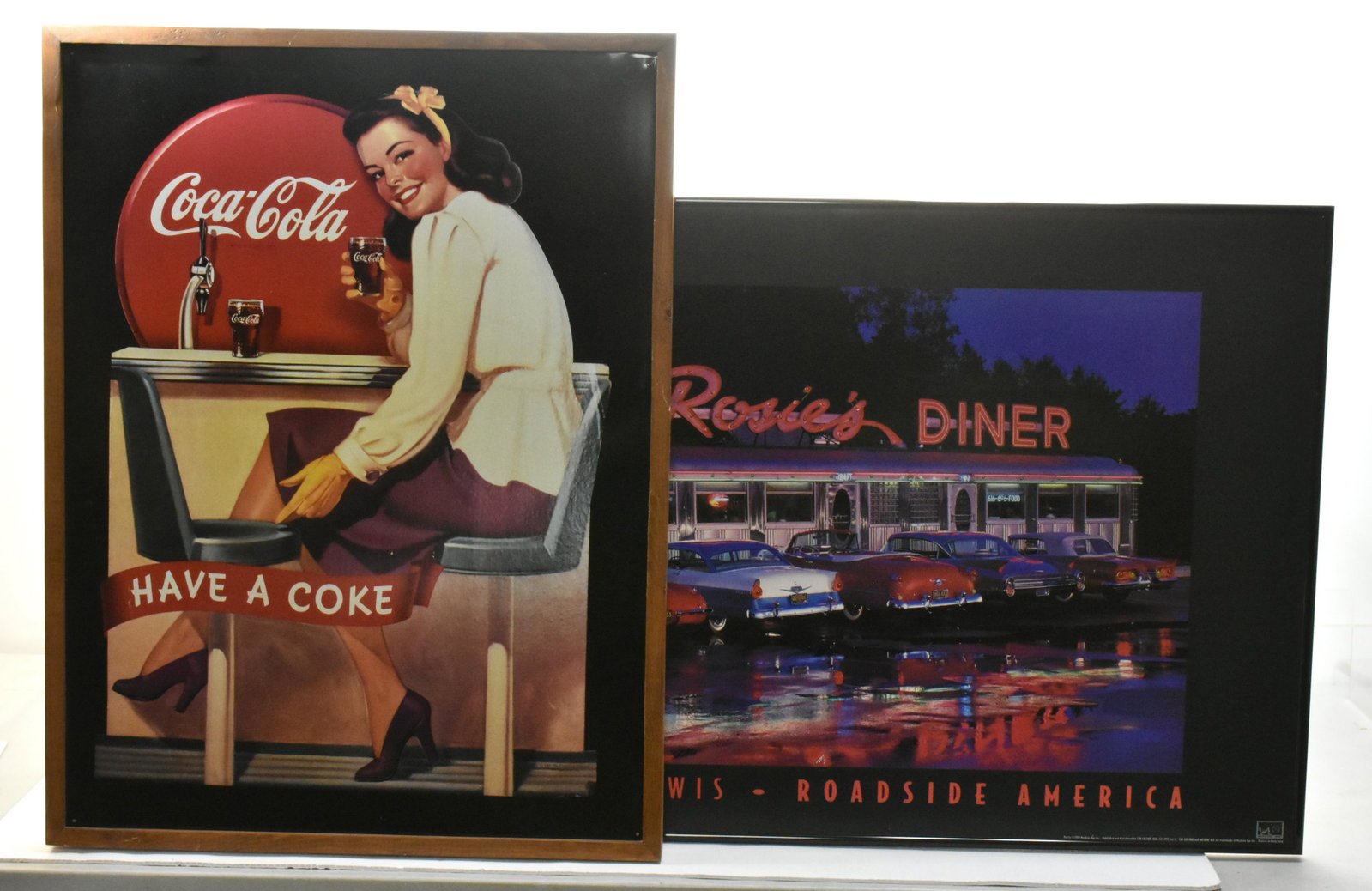 1950's Commemorative Wall Art: Including a tin Coca-cola framed sign copyright 1991 measuring approx. 23" wide x 30" high and Light up Rosie's Diner poster