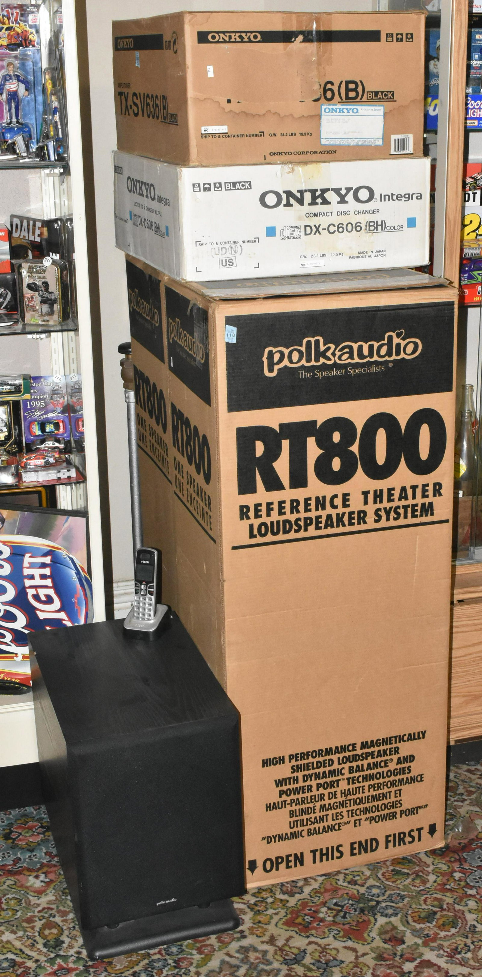 Polk Audio Home Theater Center: Includes two tower loud speakers, a floor model base speaker, a central channel loudspeaker, an Onkyo compact disc changer and an Onkyo amplifier.