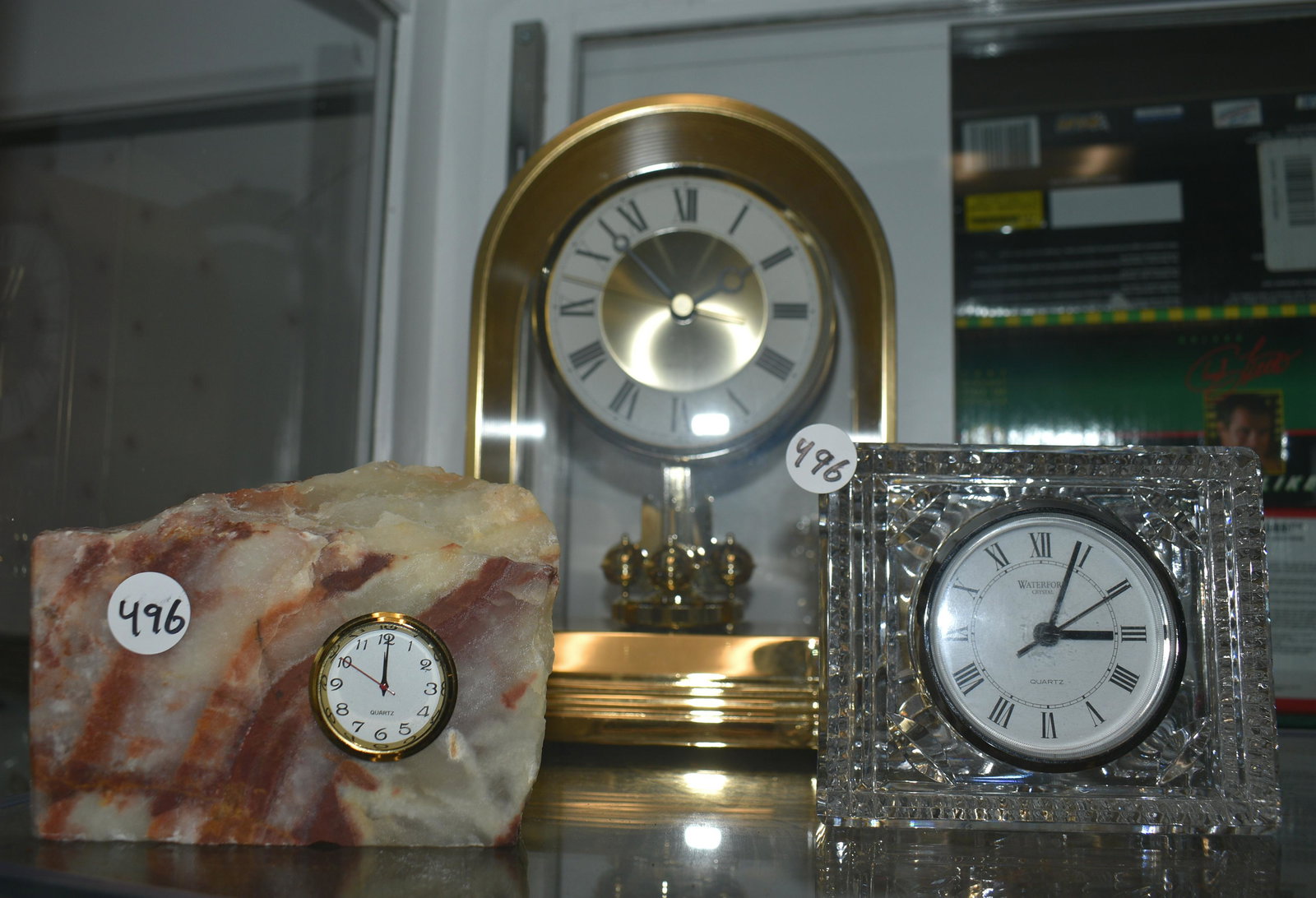 Waterford Clock and 2 Others: Lot includes a Waterford crystal clock, Seiko anniversary clock, and a mineral paper weight with clock.