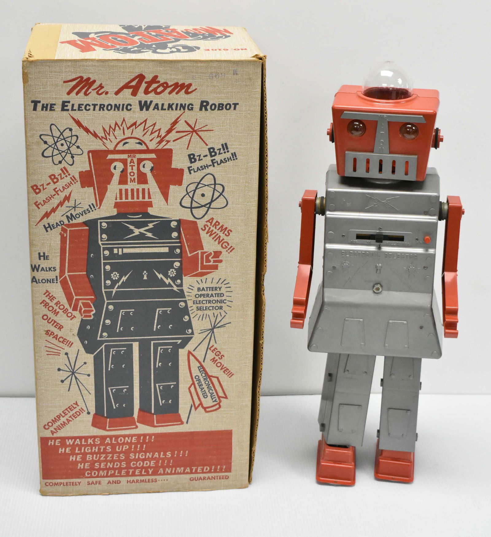 Mr. Atom Battery Operated Robot Circa 1960: Mr Atom Robot very good condition with original box, electronic walking robot by Advance Doll and Toy Co.