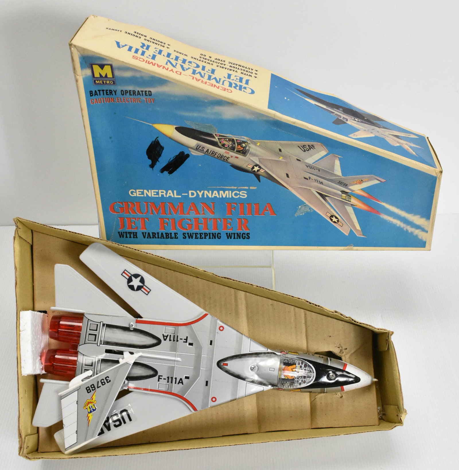 Metro Battery Operated Grumman F111A Jet Fighter: Tin litho jet fighter with variable sweeping wings, made in Taiwan Metro General-Dynamics, in original box and excellant condition (doesn't look played with).