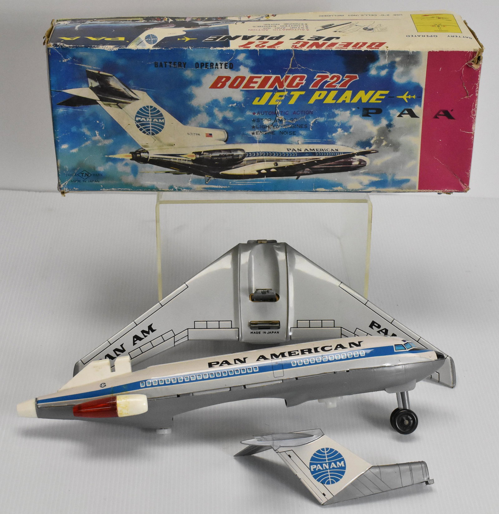 T.N Battery Operated Boeing 727 Jet Plane: Japanese tin litho of Pan Am Boeing 727 with original box (some wear), automatic action, Stop & go, lighted engines, engine noise, 15" long, model number 15017, plane in excellent shape (appears never