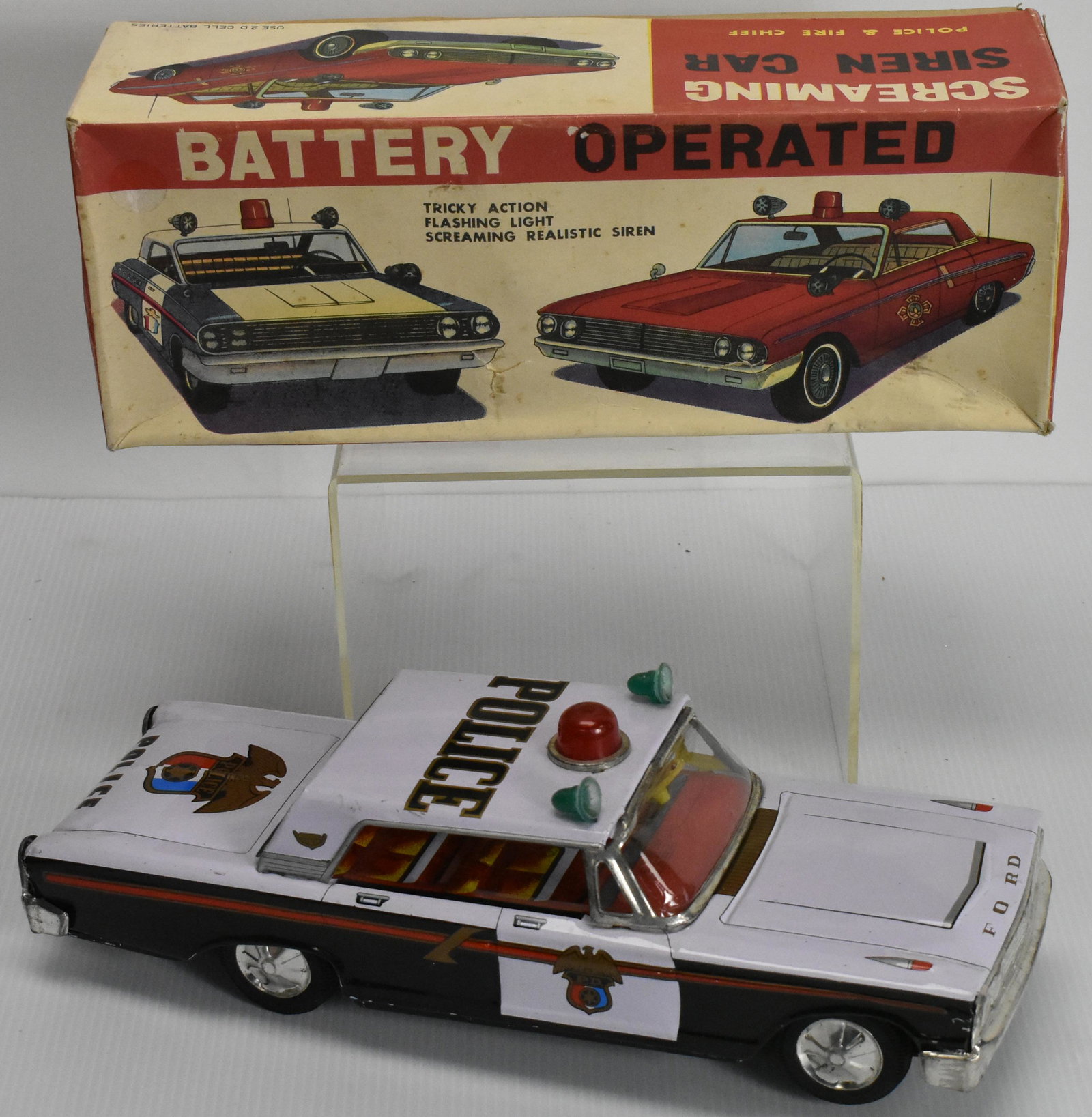 Battery Operated Screaming Siren Police Car: Made by CHIF Taiwan, mostly tin litho and some plastic elements, car in great shape with few scrapes, good condition original box