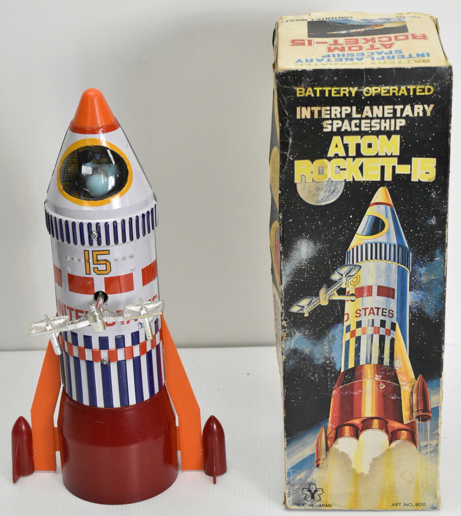 Japanese Battery Operated Atomic Rocket 15: Tin litho and plastic, original box in good condition and toy good shape and complete