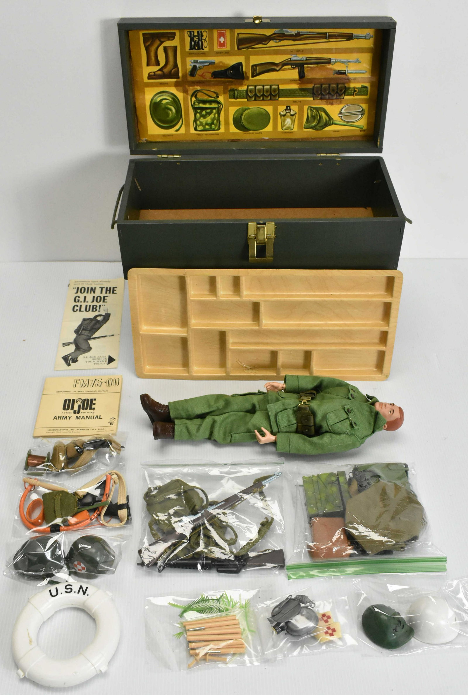 G.I. Joe Figure 1st Issue with Accessories: Marked on bottom "G.I. Joe copyright 1964 by Hasbro Pat. Pending made in USA" Comes with foot locker full of accessories including 2 rifles, 2 field gear packages, 2 sidearms, 3 helmets, manual, membe