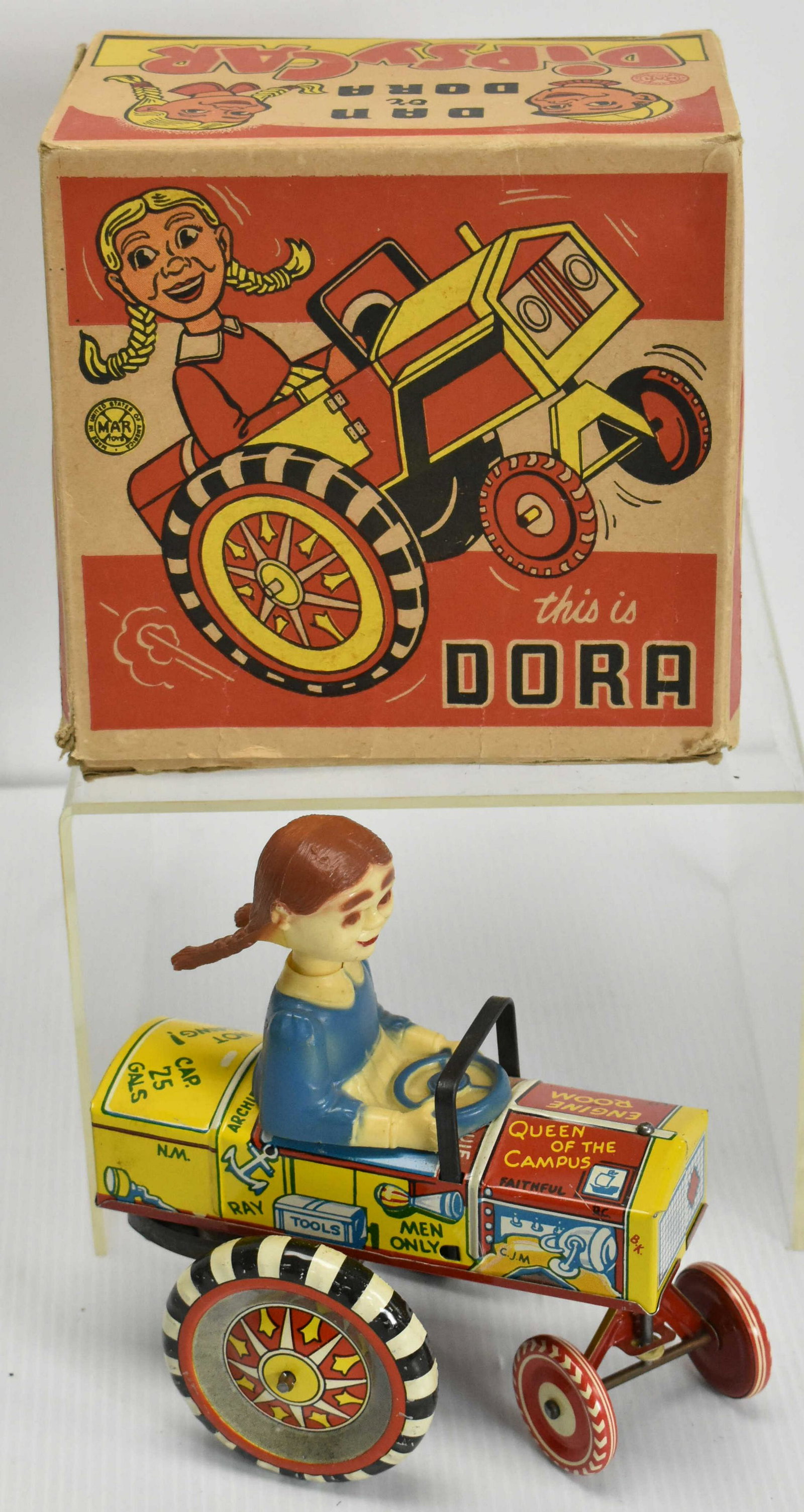 Marx Dora Dipsy Tin Toy Car with OB: Wind up toy that rolls and Dora is a bobble head. Includes original box in good condition, Dora has mark on chin and slight oxidation to gears. c1950s. Marked Marx on back end of tractor.