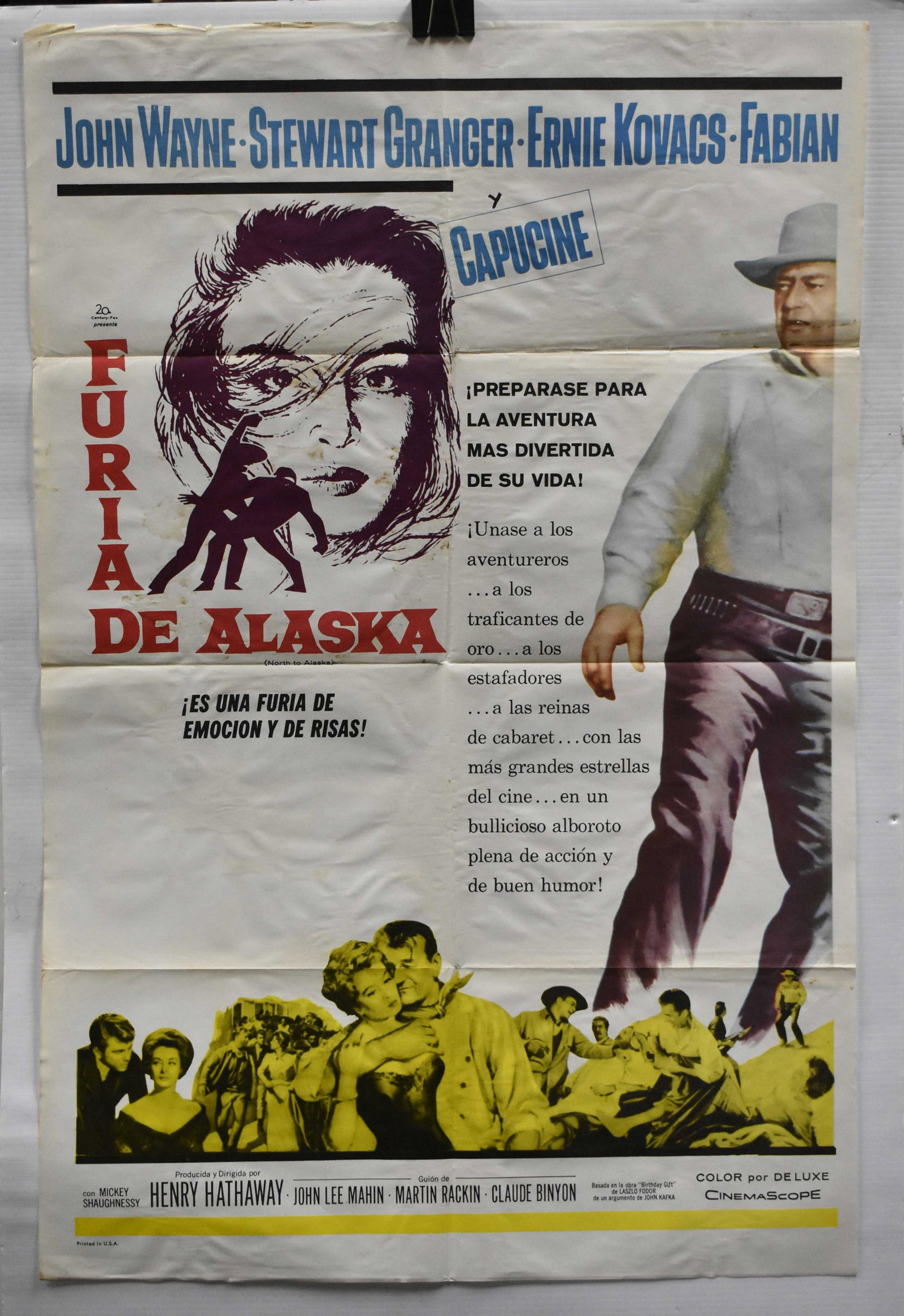 "North to Alaska" Original Poster in Spanish: Movie stars John Wayne and Stewart Granger. Printed in the USA, this poster measures approx. 41" high x 27" wide. Printed on the back it reads, "North to Alaska 1 Sheet Spanish". There is wear, tear a