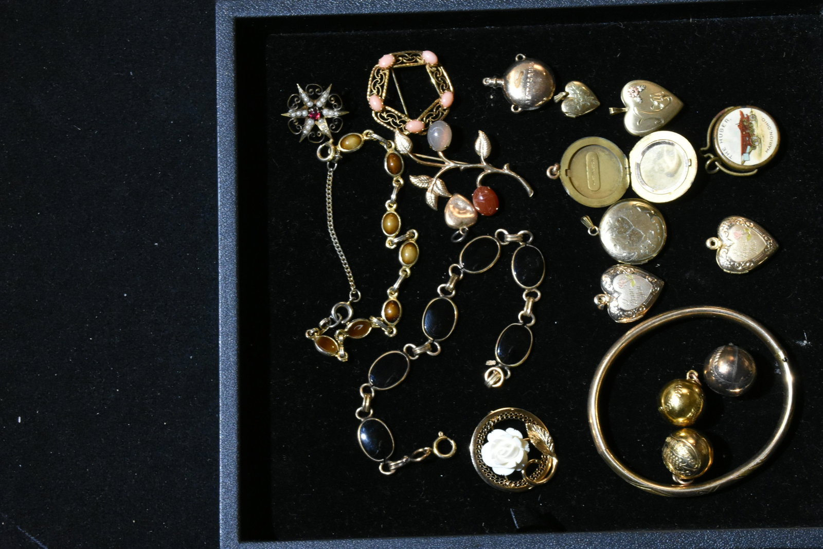 Gold Filled Jewelry Grouping: Six lockets, three basketball championship pendants, a Huber implement pendant from Marion, Ohio and various bracelets and pins.