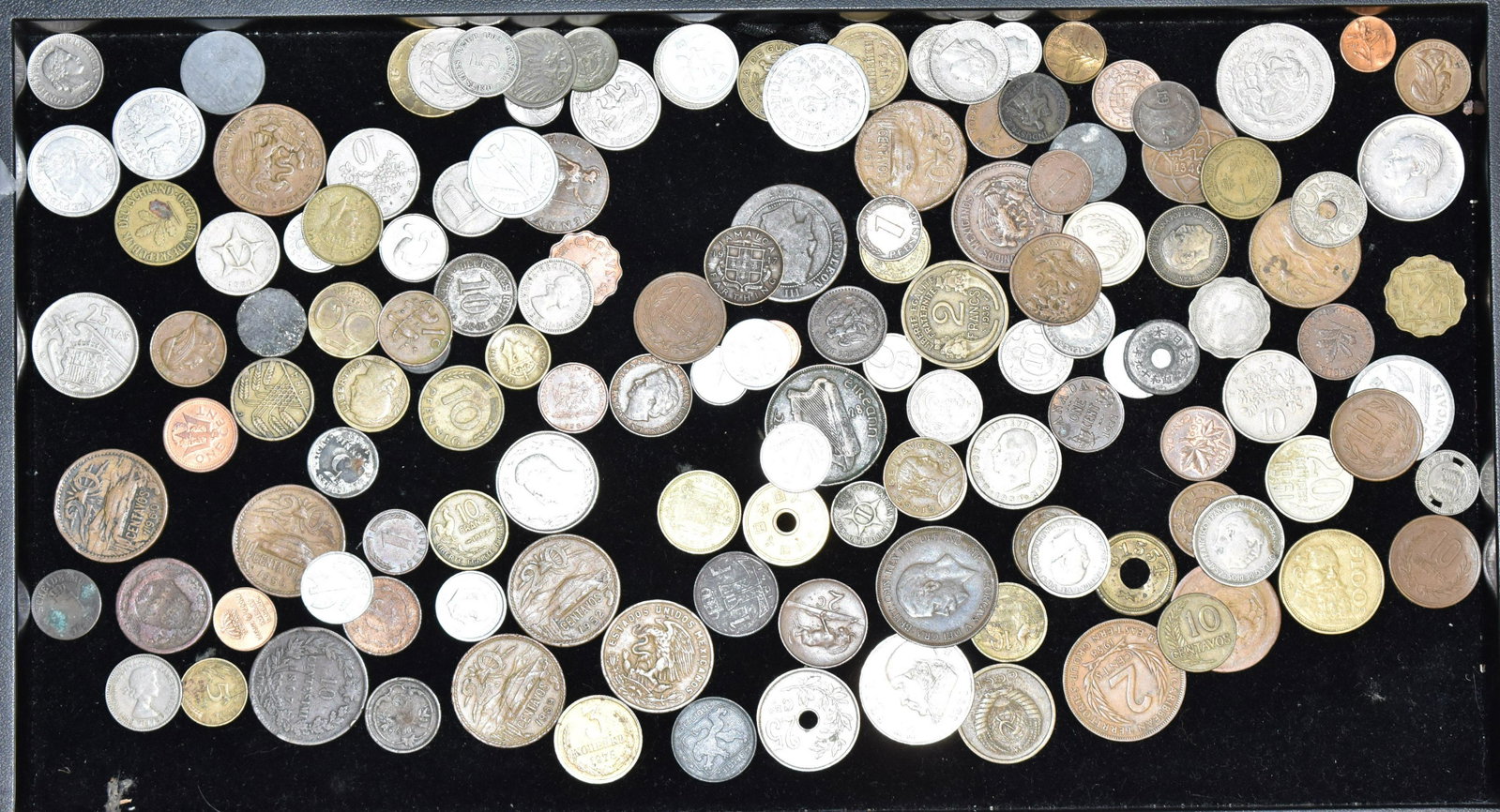 Collection of Vintage International Coins: Including a Mexican coin dated 1952, a British Caribbean coin dated 1958, a Russian coin dated 1961 and many other international coins.