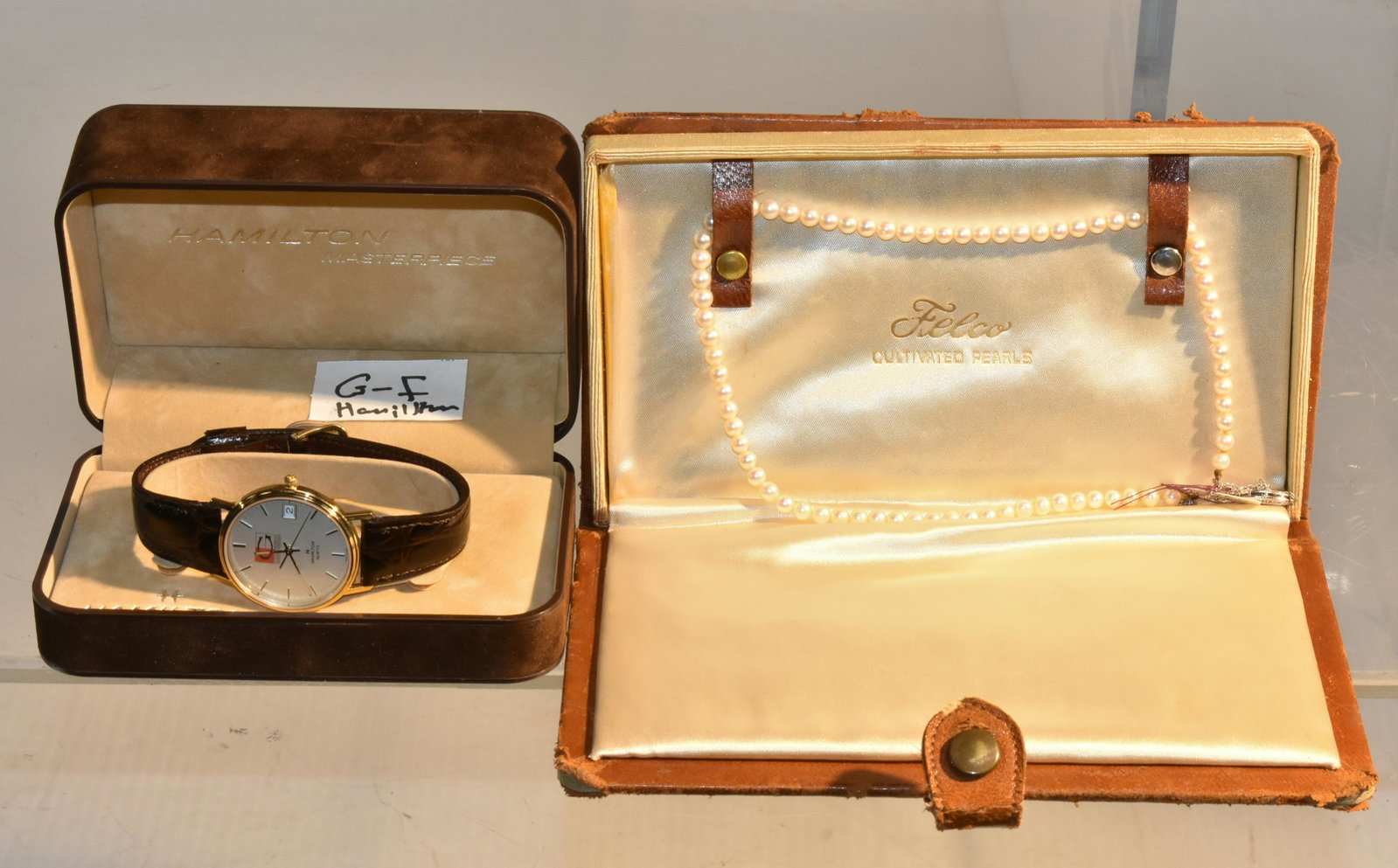 Gold and Pearl Necklace and Hamilton GF Watch: Lot includes a Felco cultivated pearl necklace with a 14K white gold chain and closure and a man's Hamilton gold filled watch with a Glatfelter Paper Mill logo on face.