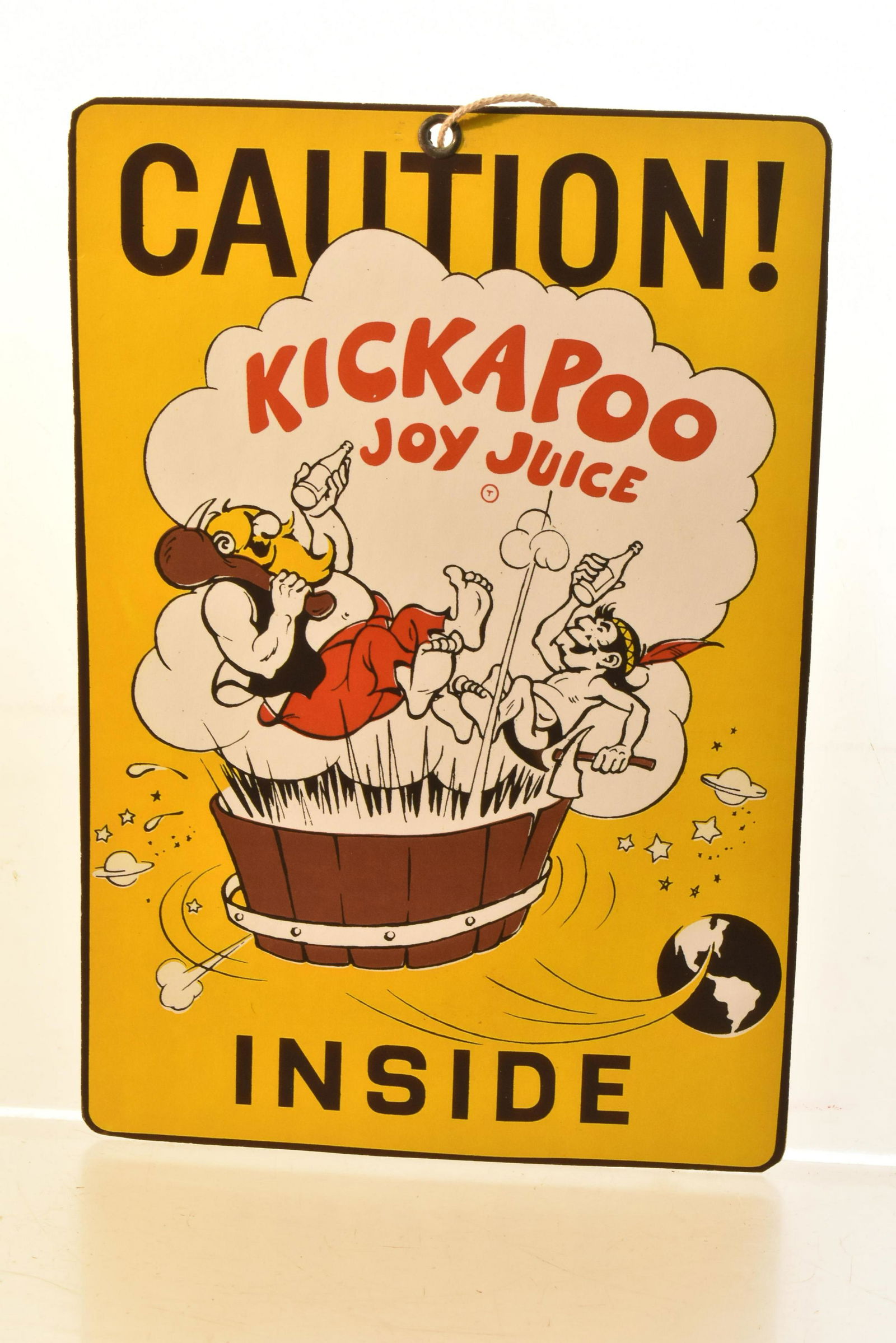 Kickapoo Joy Juice Advertising Blind Pull: Measures approx. 8"h x 5 1/2"w. It is a cardboard blind pull with good graphics and appears to be unused.