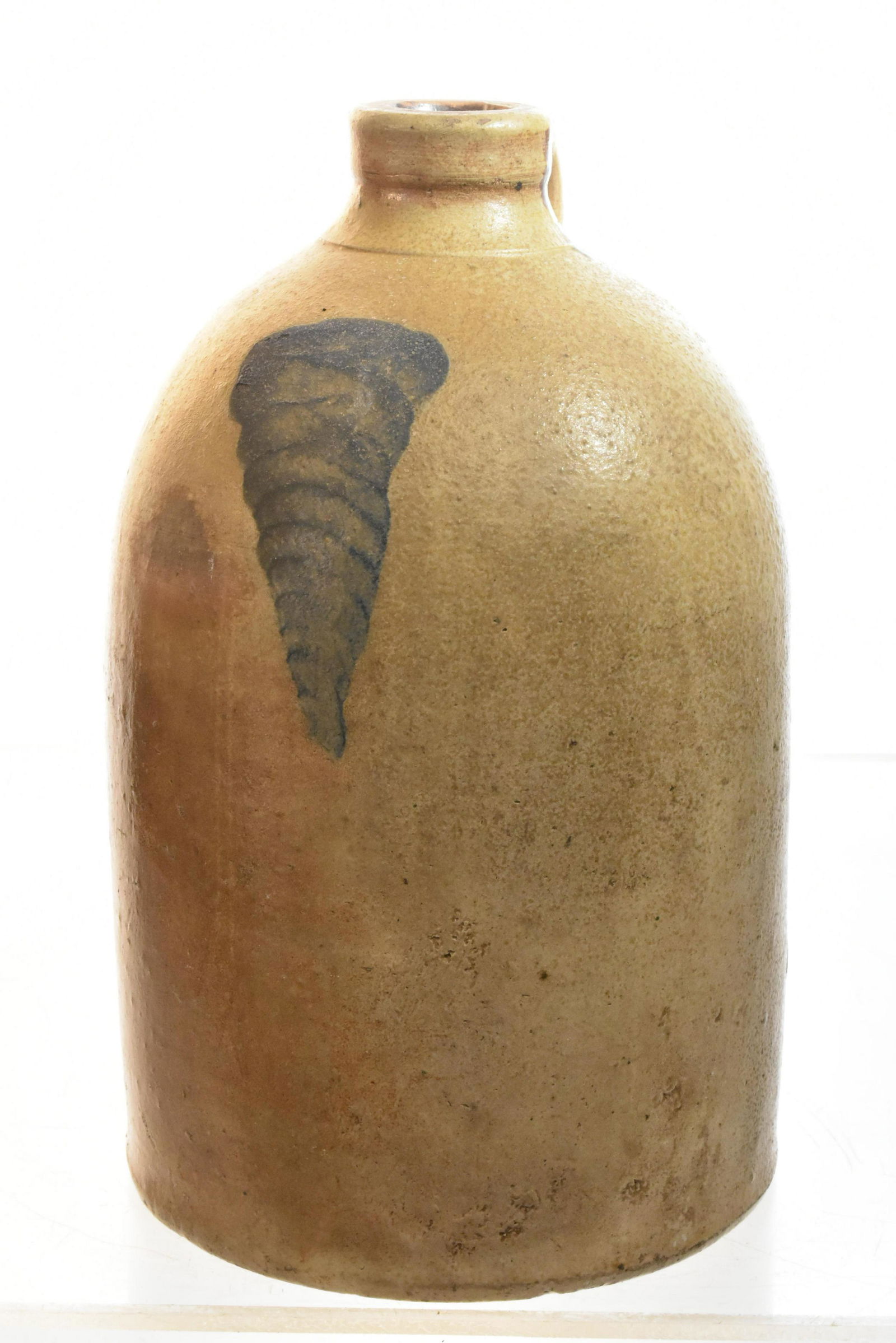 19th Century Blue Decorated Jug: Measures approx. 11 1/2"h. It has a light colored glaze with blue decoration on front, minor common roughness at bottom and is free of chips and cracks.