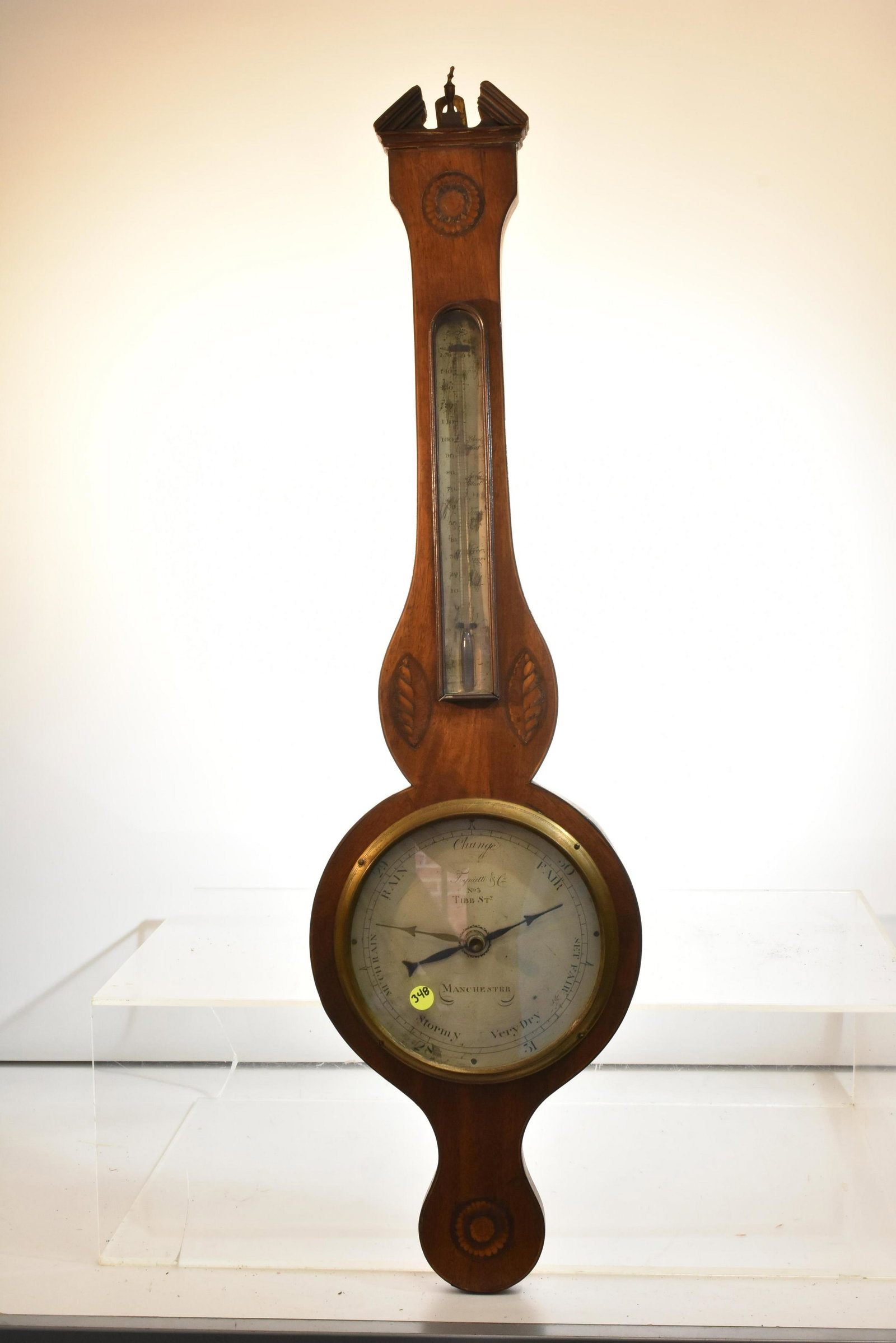 19th Century "Tognietti & Co" Ornate Barometer: Measures approx, 39"h. It is mahogany construction with Marquetry inlay. It has a thermometer above barometer. It retains the brass finial which is bent at top. Item is not functioning.