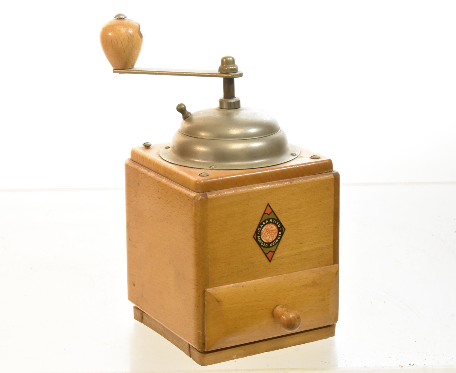 Art Deco Coffee Grinder: Measures approx. 8"h. It is a "Garantied" brand forged grinder. Item is functional and has a good label.