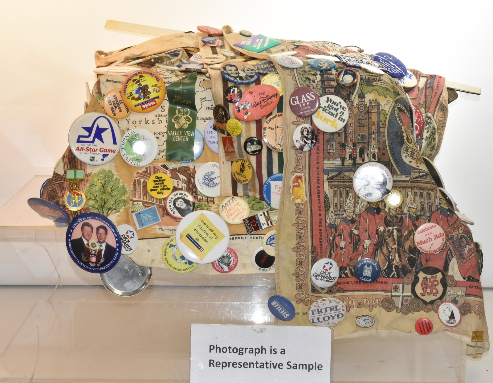 Large Pin Back Collection: Over 100 political and other pin backs all attached to curtains.