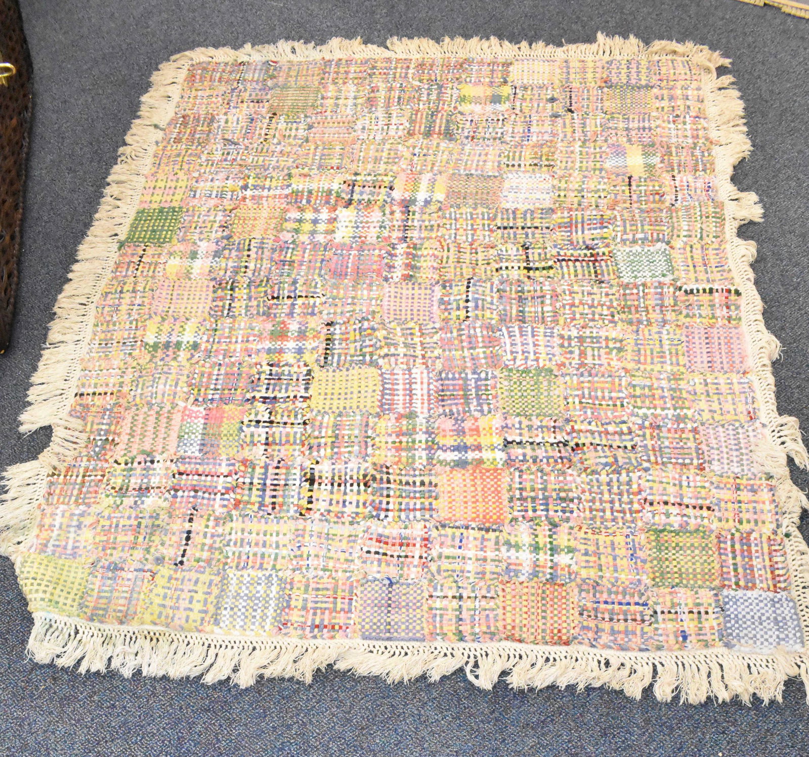 Hand Knotted Rug or Throw: Measures approx 78" x 52" not including fringe and hand knotted sections in square patterns resembling pot holders. Completely hand knotted and appears to date to the 1940s. Pastel colors.