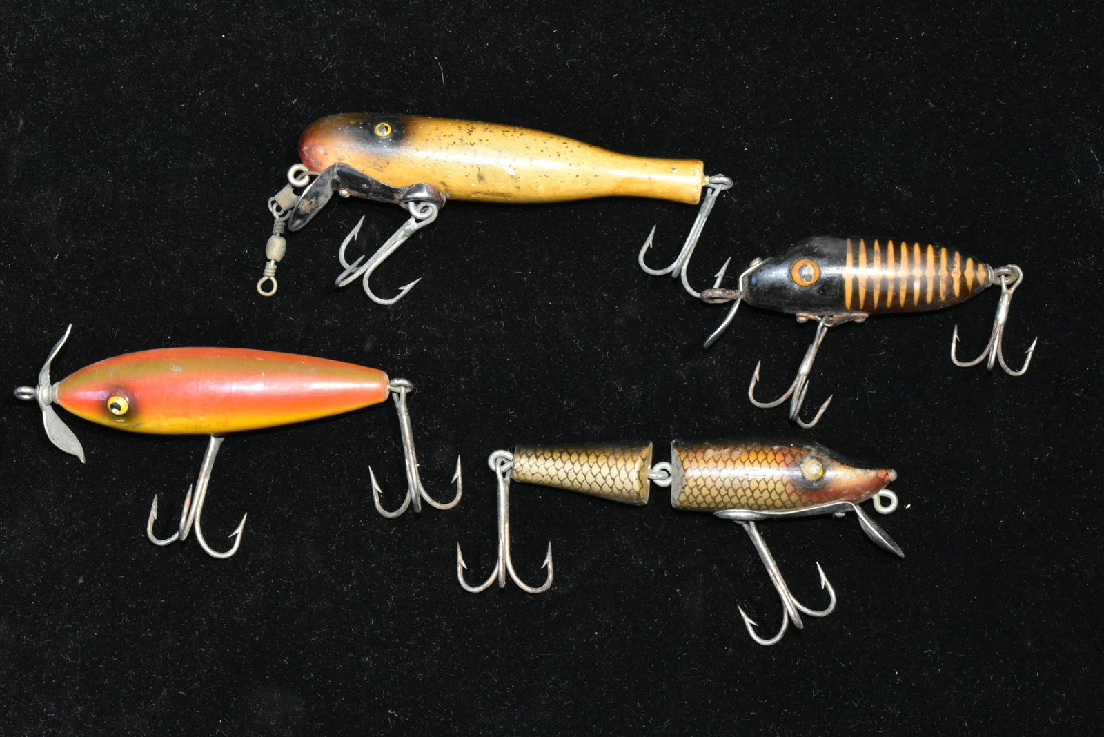 Vintage Wooden Fishing Lures: Largest measures approx. 4" in length not including hooks and is marked "Paw-Paw". Three others - one with spinner.