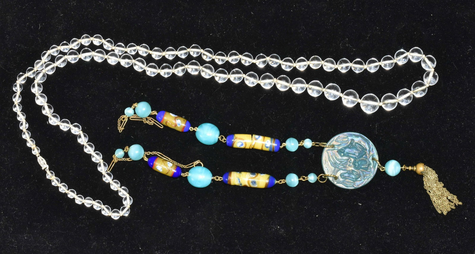 Sea Glass Necklace and Italian Millefiori: Lot includes a beaded sea glass necklace measuring approx. 34" in length and a millefiori necklace with a frosted glass frog pendant and a glass finial. Note: Two millefiori glass sections are cracked