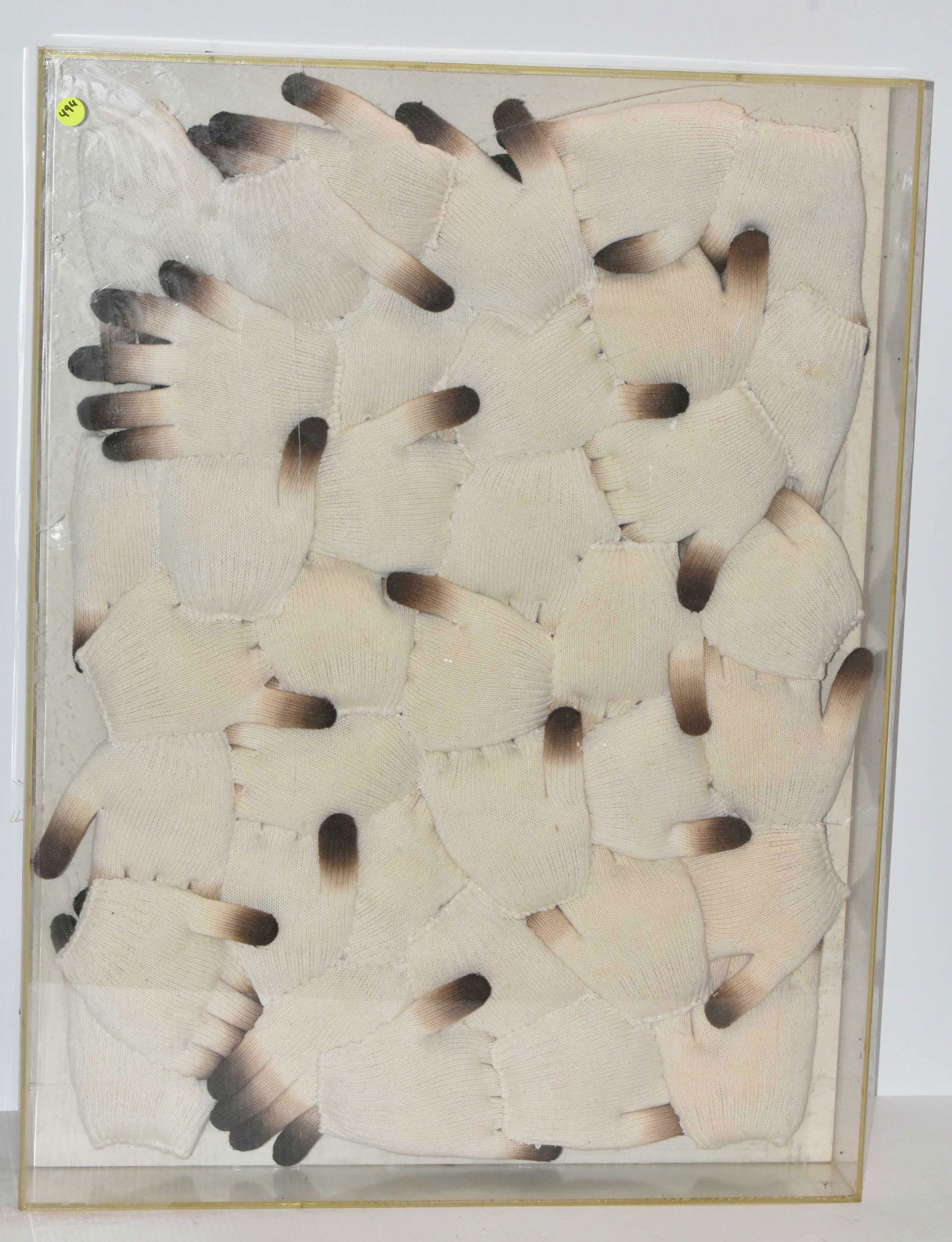 Artwork by listed Korean artist Kyung-Yeun, Chung: The Dyed Glove Collage piece is contemporary art in Lucite shadowbox measuring approx. 32" x 24." The contents are a grouping of stuffed and dyed cotton gloves in a Lucite shadow box. Chung is a liste