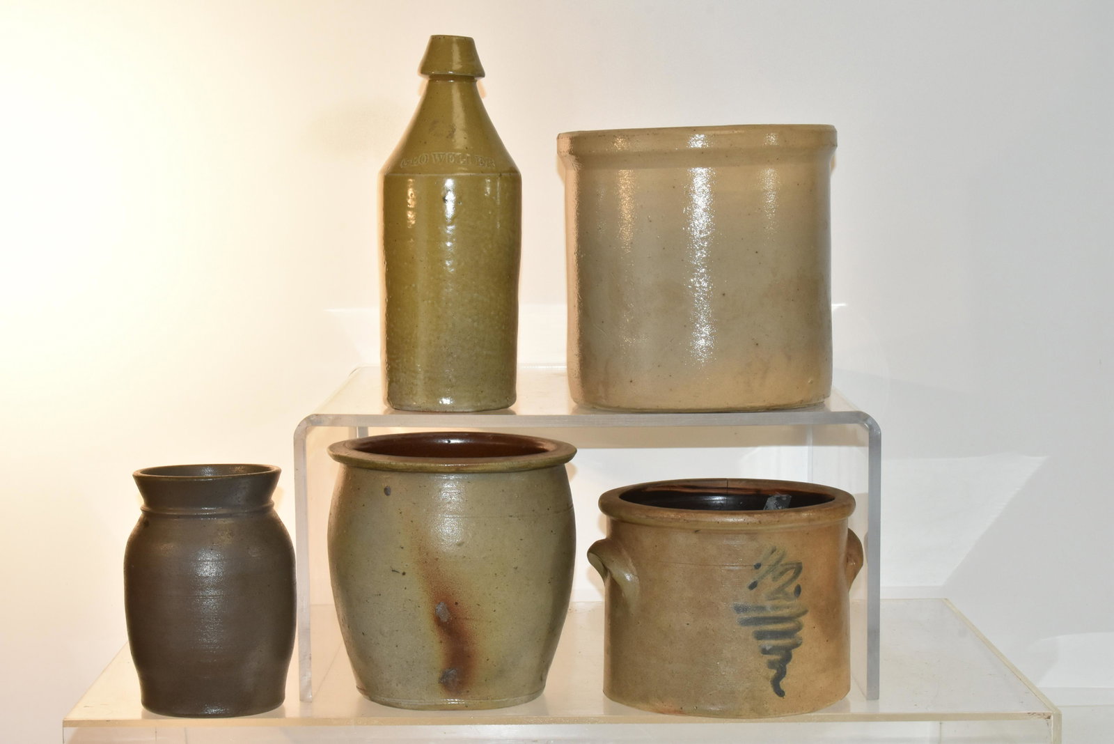 (5) Pieces of Vintage Stoneware: Lot includes a George Weller stoneware bottle, a salt glazed vessel, a bell shape and straight crock, and a decorative crock with crack.
