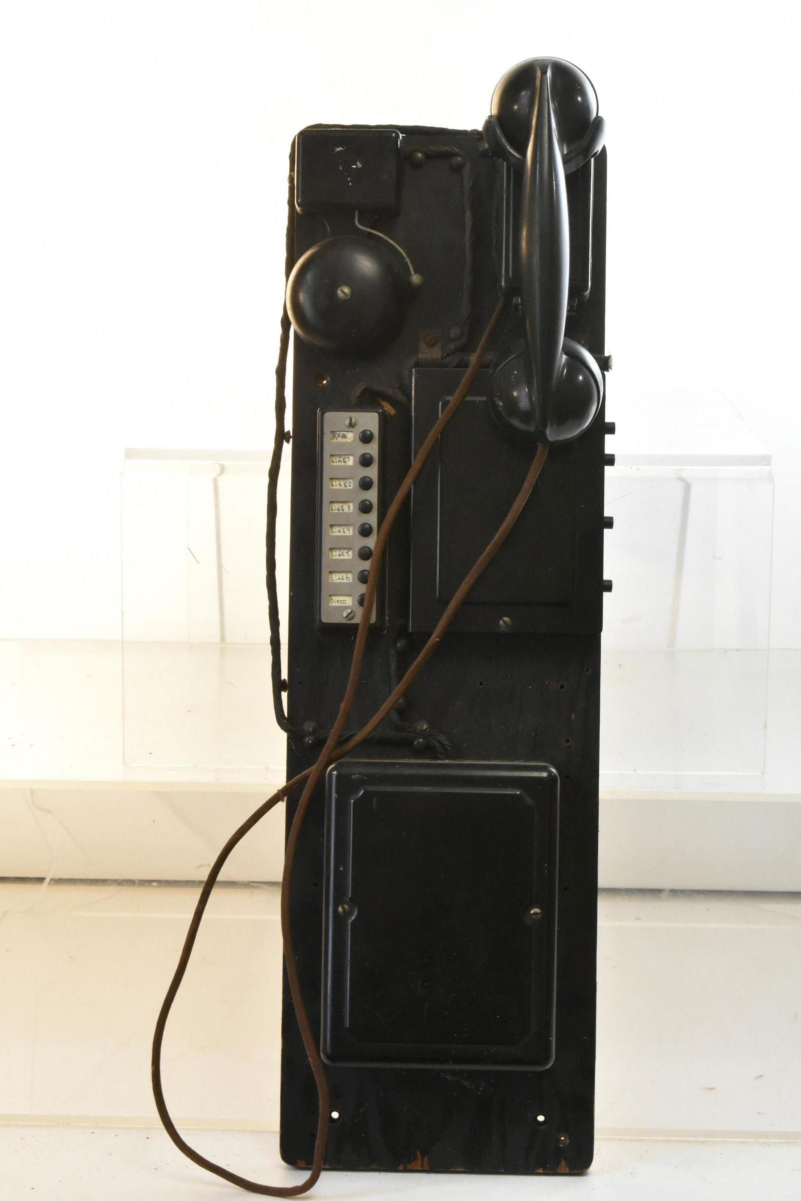 Vintage Hotel Call Box: Item measures approximately 26"H x 8"W. It is an 8-button call box, with original receiver and bell. It appears to be complete, and receiver reads "Bell System, Manufactured by Western Electric Co".
