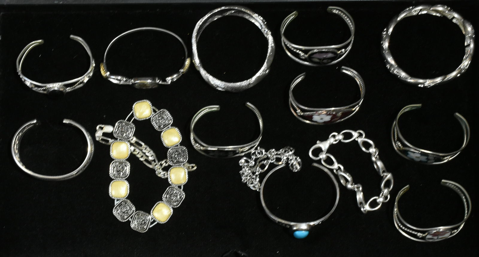 Sterling and Other Bracelets: Lot includes sterling cuff with beading, (5) inlaid Alpaca bracelets, native bracelet with onyx, Monet hinged cuff, sterling chain bracelet, and more.