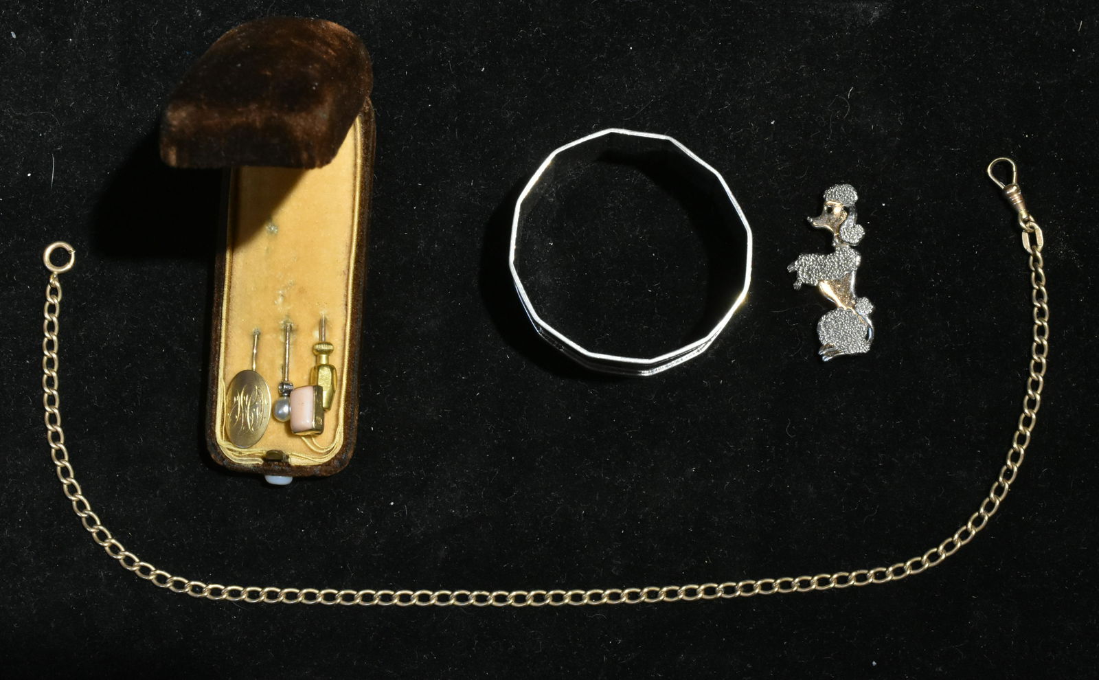 Hat Pins and Sterling: Lot includes a sterling poodle pin, a coin silver napkin ring, a gold plated watch fob, and a set of (3) hat pins in a velvet case.