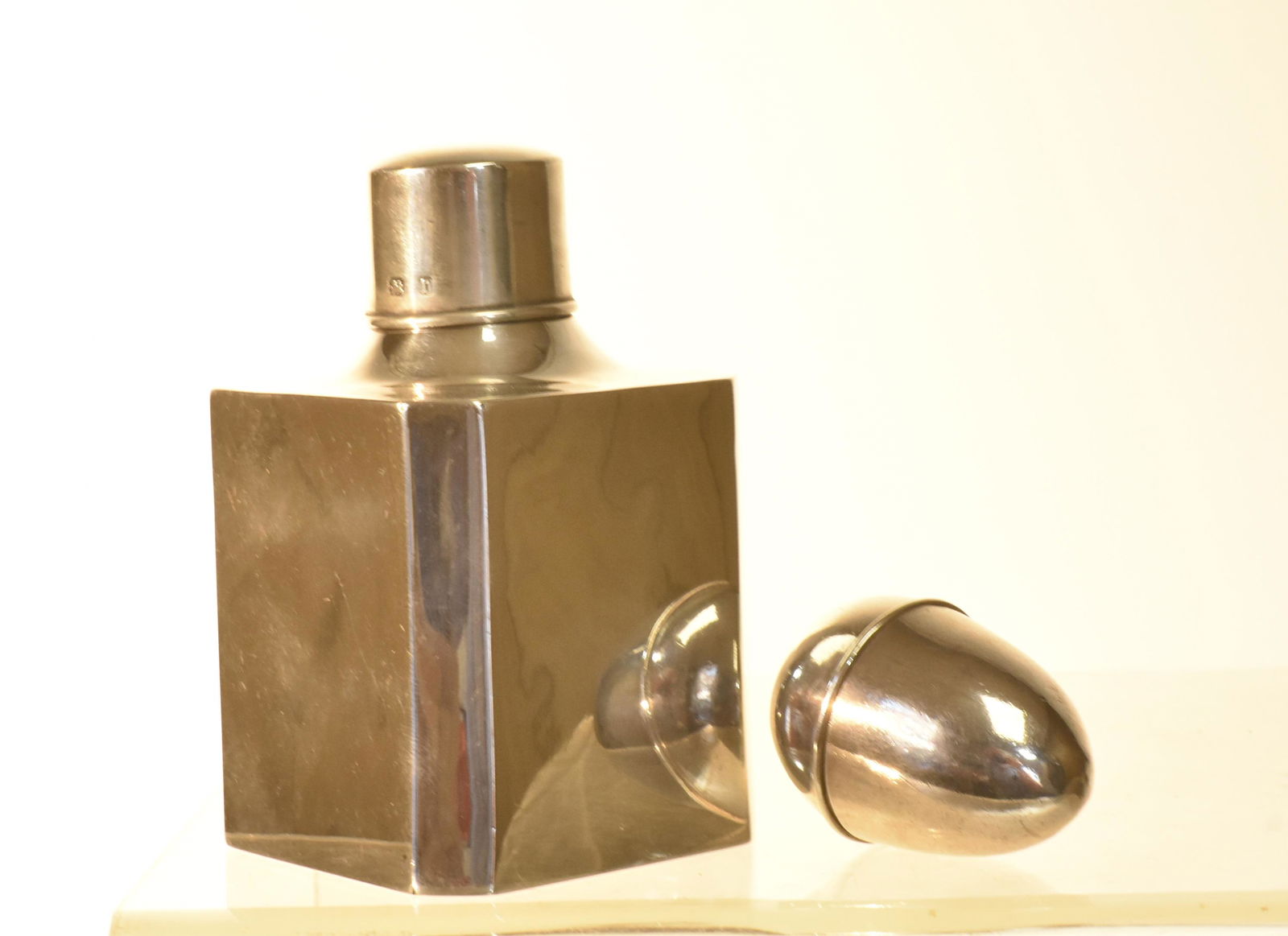 1820: Item measures approximately 1.75"L, it has original interior strainer (no grater), and it is unmarked. Lot also includes a Birmingham silver tea caddy from 1876. Tea caddy has minor dents.