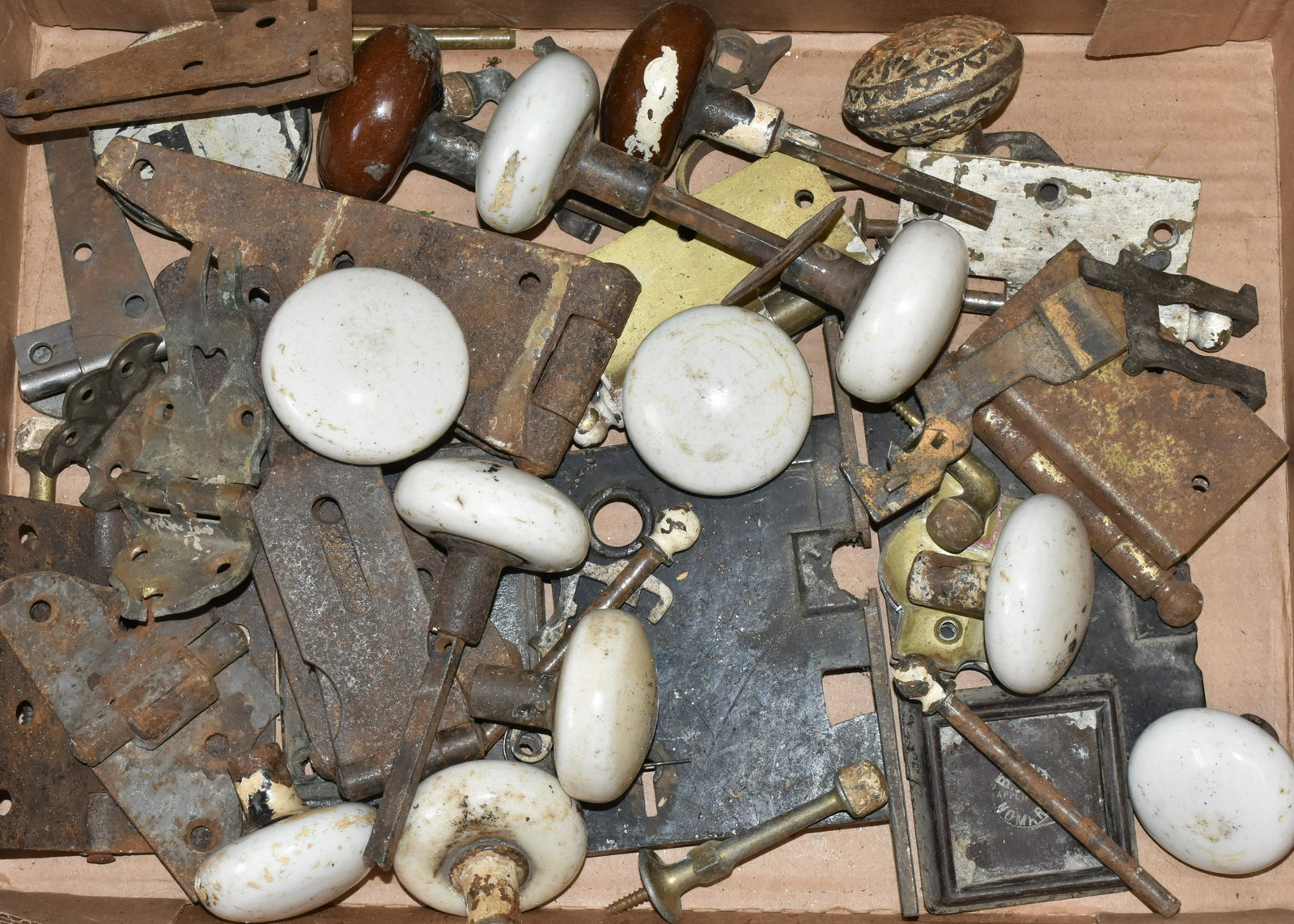 Door Knobs and Vintage Hardware: Lot includes (13) vintage doorknobs, strap hinges, and other hardware.