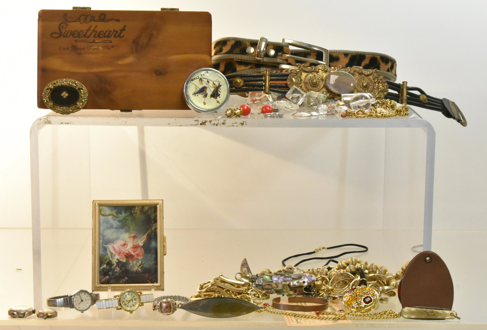 Costume Jewelry and Belts: Lot includes gold tone belts, a faux leopard belt, a fish necklace, Timex watches and other items.