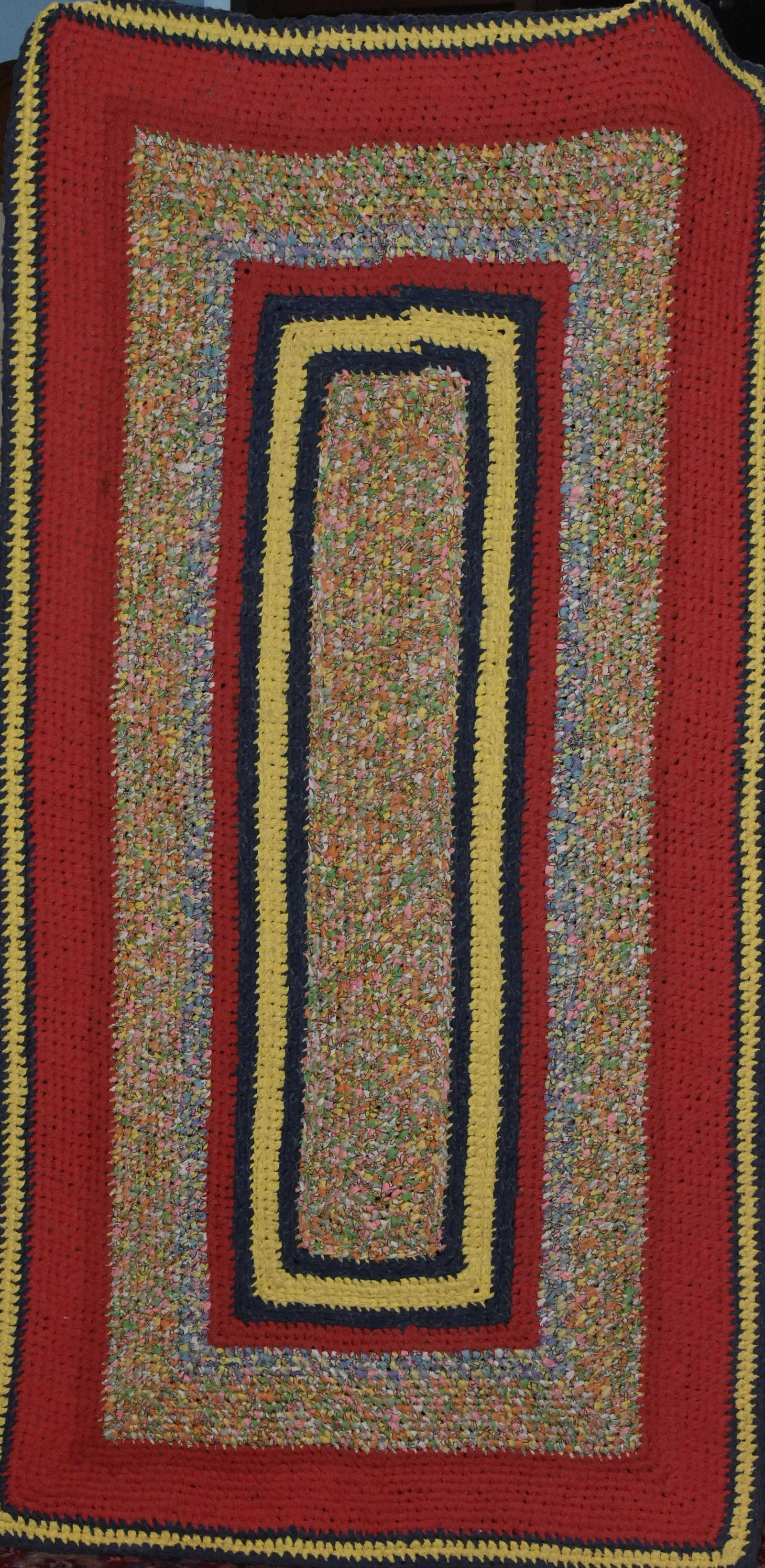Hand Knotted Rag Rug: Item measures approximately 74"L x 38"W. It is entirely hand knotted, and in overall good condition.