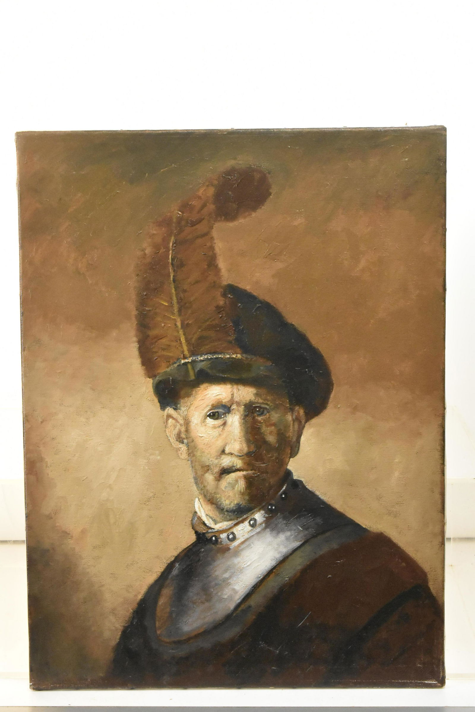 Oil on Canvas by Neubauer After Rembrandt: Item measures 24"H x 18"W, and it is titled "Man in a Plumed Hat and Gorget" on back. It is hand signed Neubauer on back. Richard Neubauer is a listed artist from York County PA.