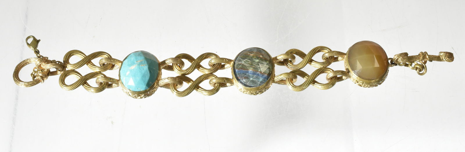 Stephen Dweck Designer Bracelet: Item is a large sterling and bronze topped double link toggle bracelet with large turquoise, carnelian and banded agate stones.