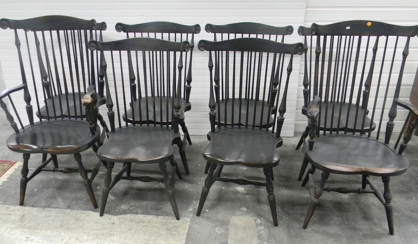 Set of (8) Contemporary Windsor Chairs: Lot includes (2) armchairs and (6) armchairs. They are artisan made, and all have black painted surfaces. Seat height approx 16.5" to 17.25" at middle point, width approx 15" at narrowest to 17" at wi